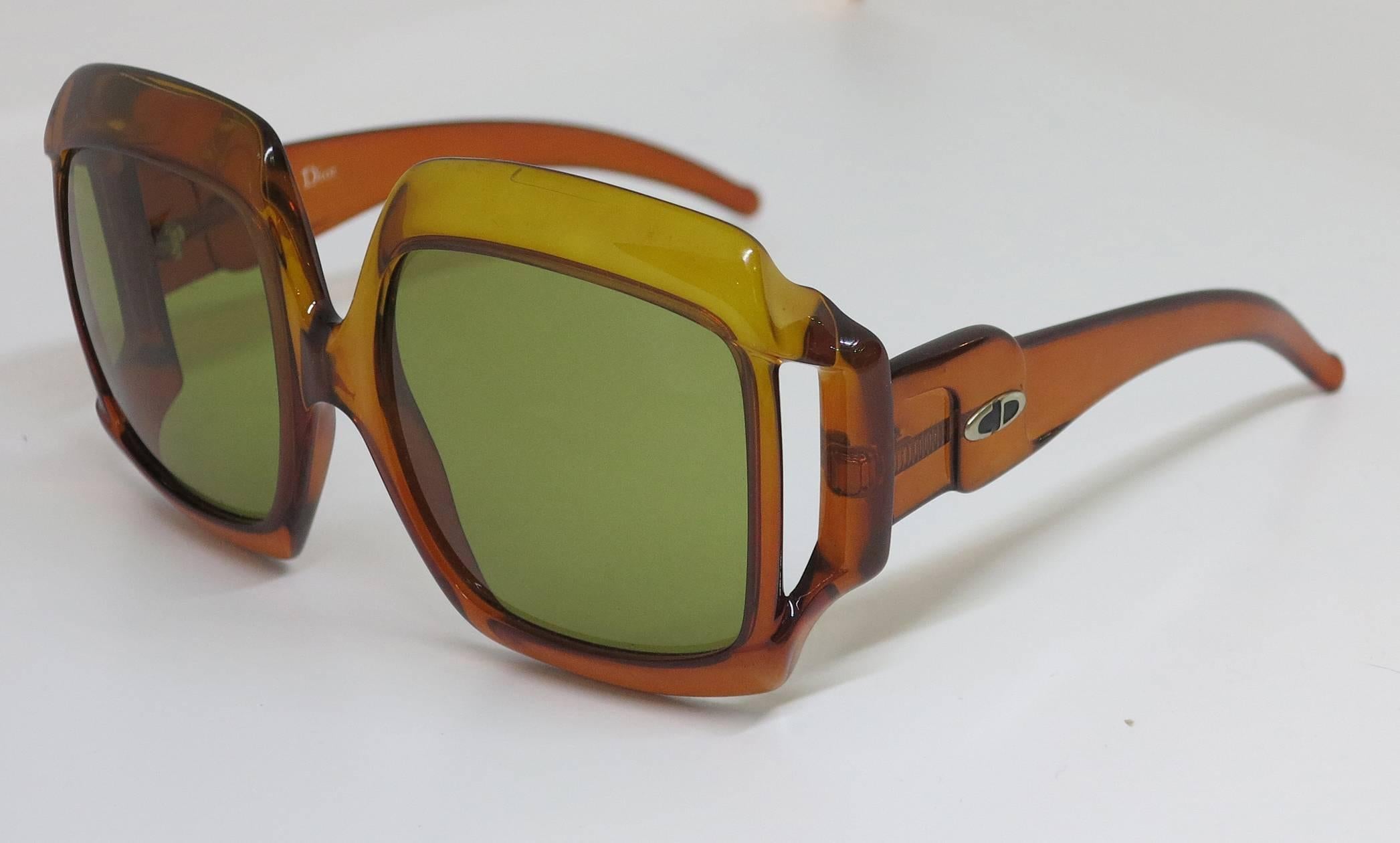 Christian Dior dark amber big square sunglasses from the 1970s...Approximately 6 1/8" wide x 3" high 5 3/4" side piece front to back...In excellent condition, lenses with extremely light wear, lenses are amber/brown colour.