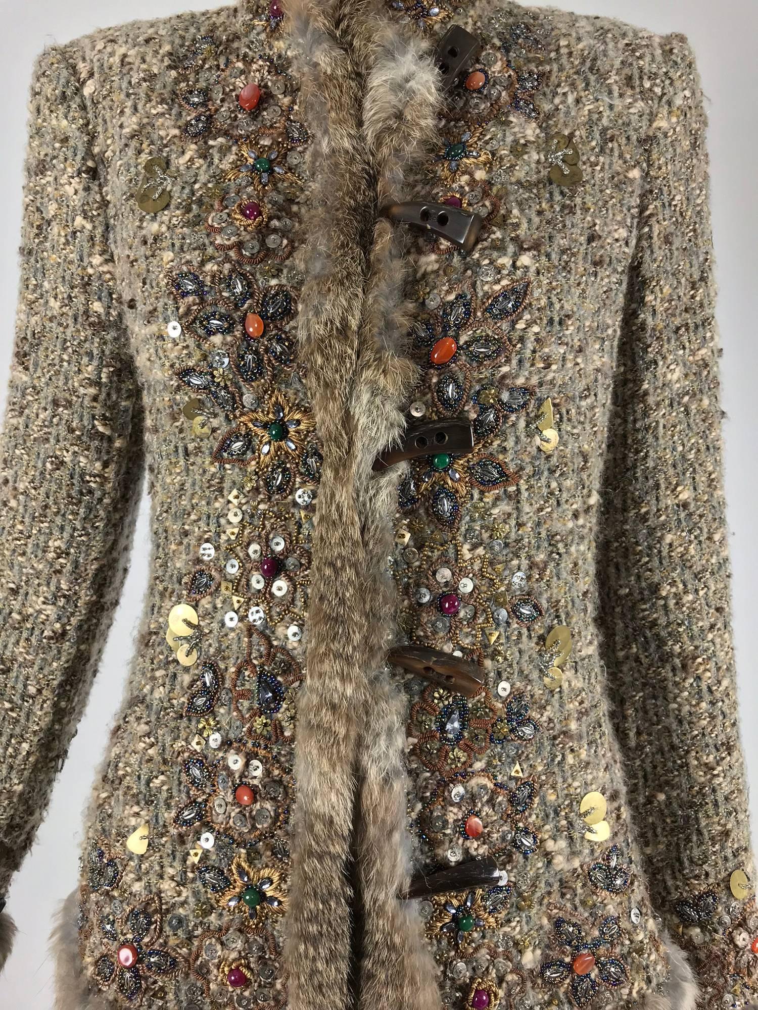 Oscar de la Renta jewel and fur trim soft tweed knit skirt set...Beautiful Jacket and skirt set in rich warm tones of brown, the fabric is a soft knit...The jacket and the skirt are trimmed with coloured jewels, metal sequins of different shapes and