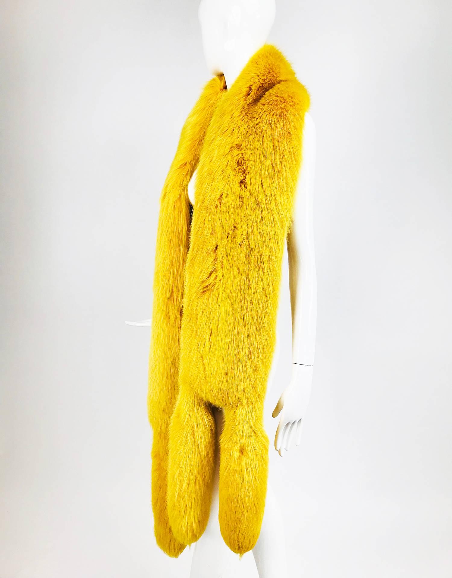 Saffron yellow fox fur stole with tails 1980s...Beautiful and unusual, this stole is wide and long...The fur is thick and in excellent condition...Lined in Saffron cut velvet and brocade...

In excellent wearable condition... All our clothing is dry