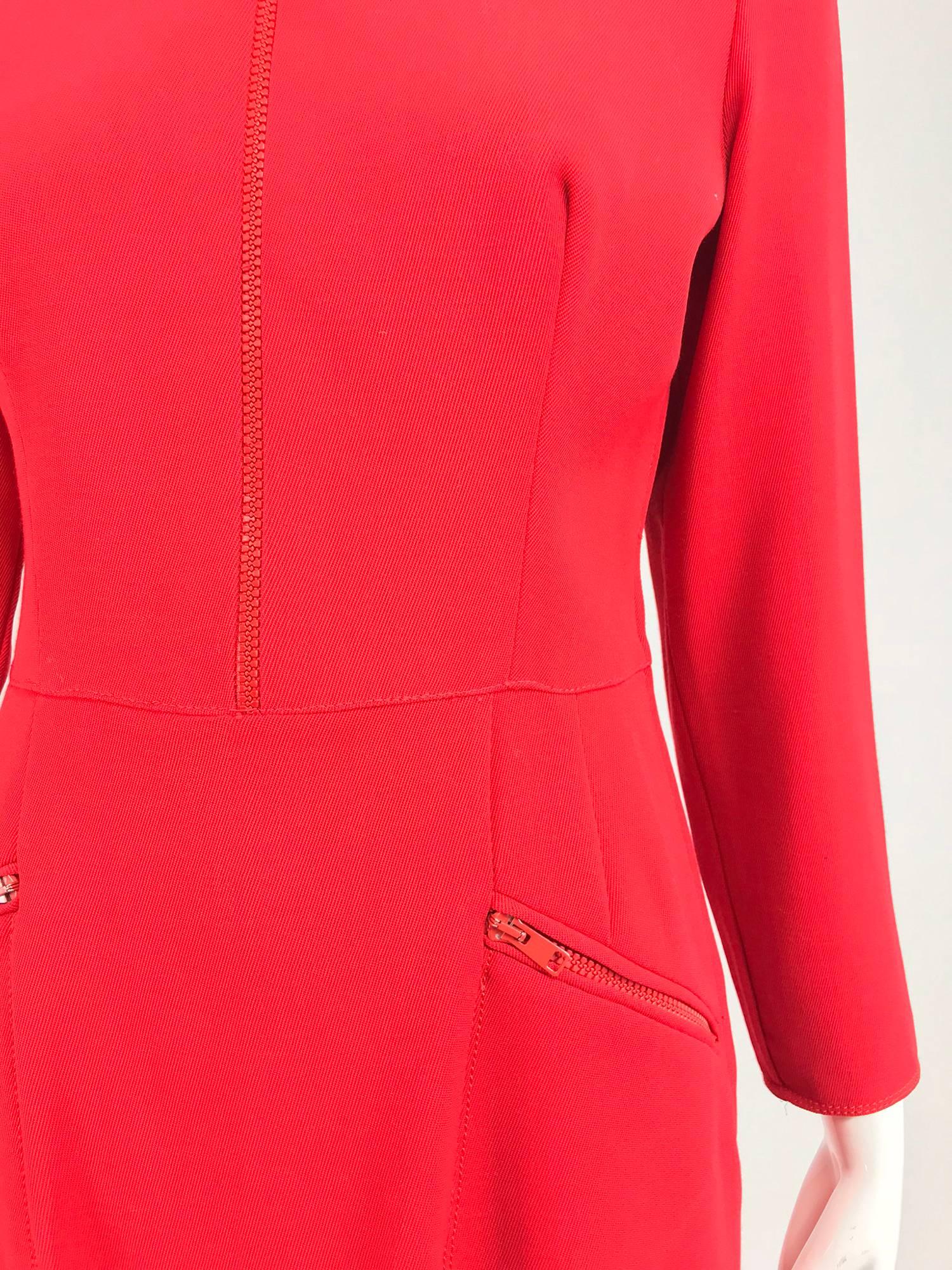 Vintage Valentino tailored red wool twill zipper dress from the 1990s...Light weight bright red wool dress closes from the waist to the mock neck with an oversize red zipper, long tapered sleeves with oversize zippers at each cuff, vertical bust