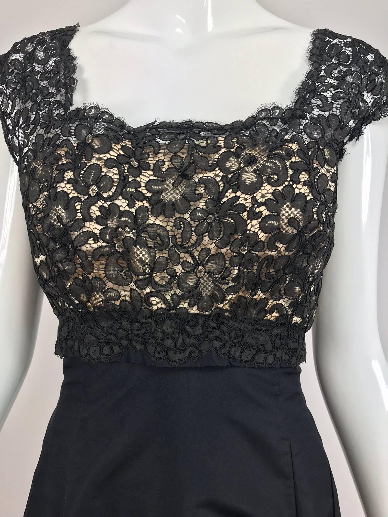 Vintage 1950s black silk and lace cocktail dress, beautifully made dress in a classic late 1950s style. The black Guipure lace bodice is lined with sheer nude fabric, the shoulder straps are wide and cover the shoulder top edge. The attached skirt