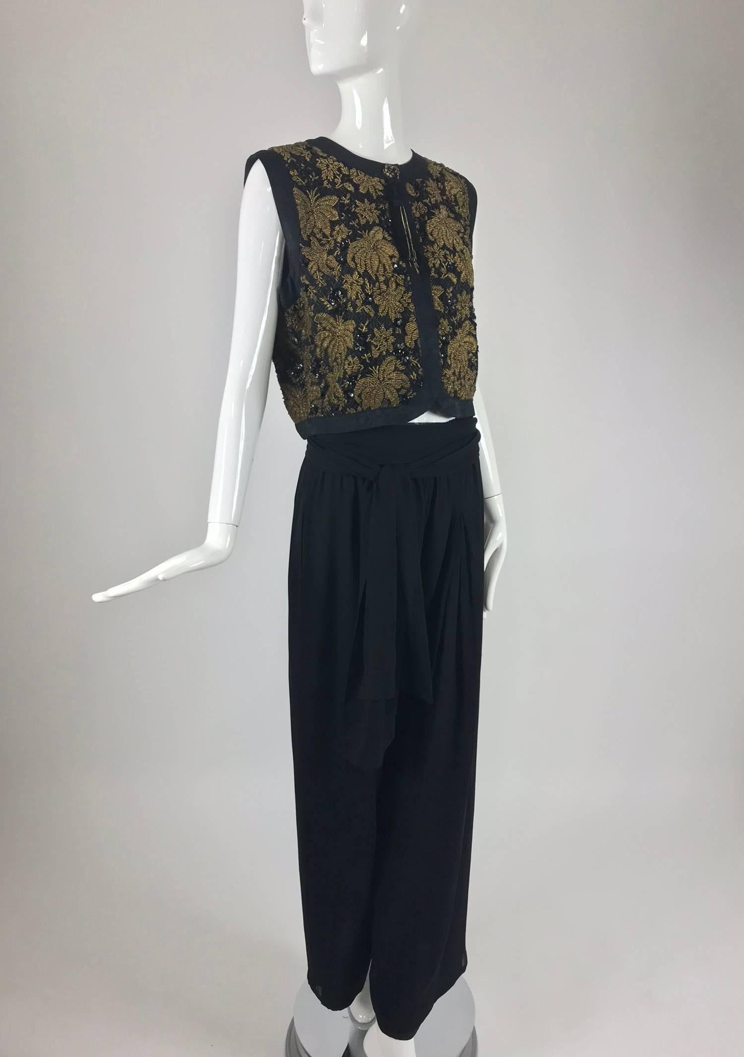 Diane Freis Gold Beaded silk Vest and Full silk Trouser from the 1970s...Gold beaded vest has figured silk facings, fully lined, closes with a hidden snap, there is a beaded tassel at the vest top...Full leg black silk chiffon trouser with smocked