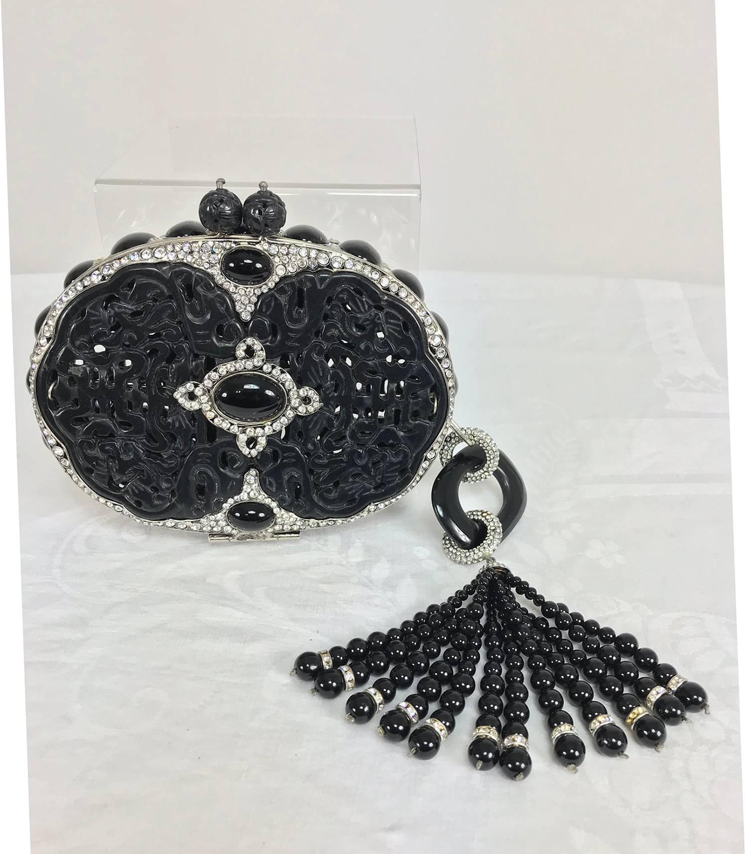Iradj Moini Carved Black Jade Minaudière with rhinestone accents and extraordinary tassel...This rare and exotic bag from renowned jeweler Iradj Moini is a jewel for the evening table...Oval bag with an interior metal frame, the outside of the bag