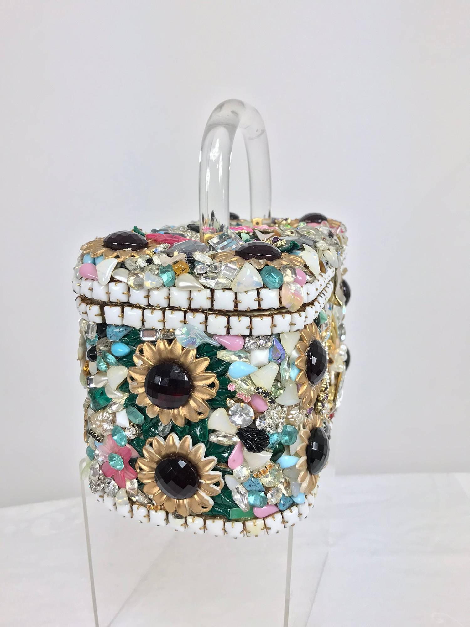 Custom made jewel encrusted Lucite hanle hand bag from the 1980s...Glittery bag covered with jewels, flowers, rhinestones, pearls, glass flowers, enamel flowers and much much more! Rising above is a clear Lucite handle...The bag has a gold metal