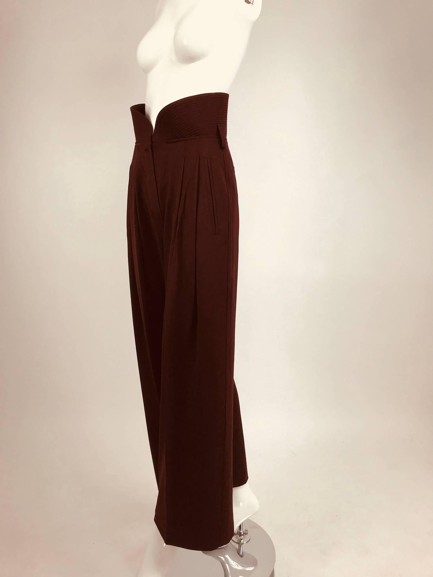 Claude Montana Shaped quilted high waist trouser from the 1980s in Burgundy fine wool gabardine...Stitched down hip front pleats, angled front besom pockets, back horizontal pockets...Full leg trouser with an exaggerated quilted waist...These