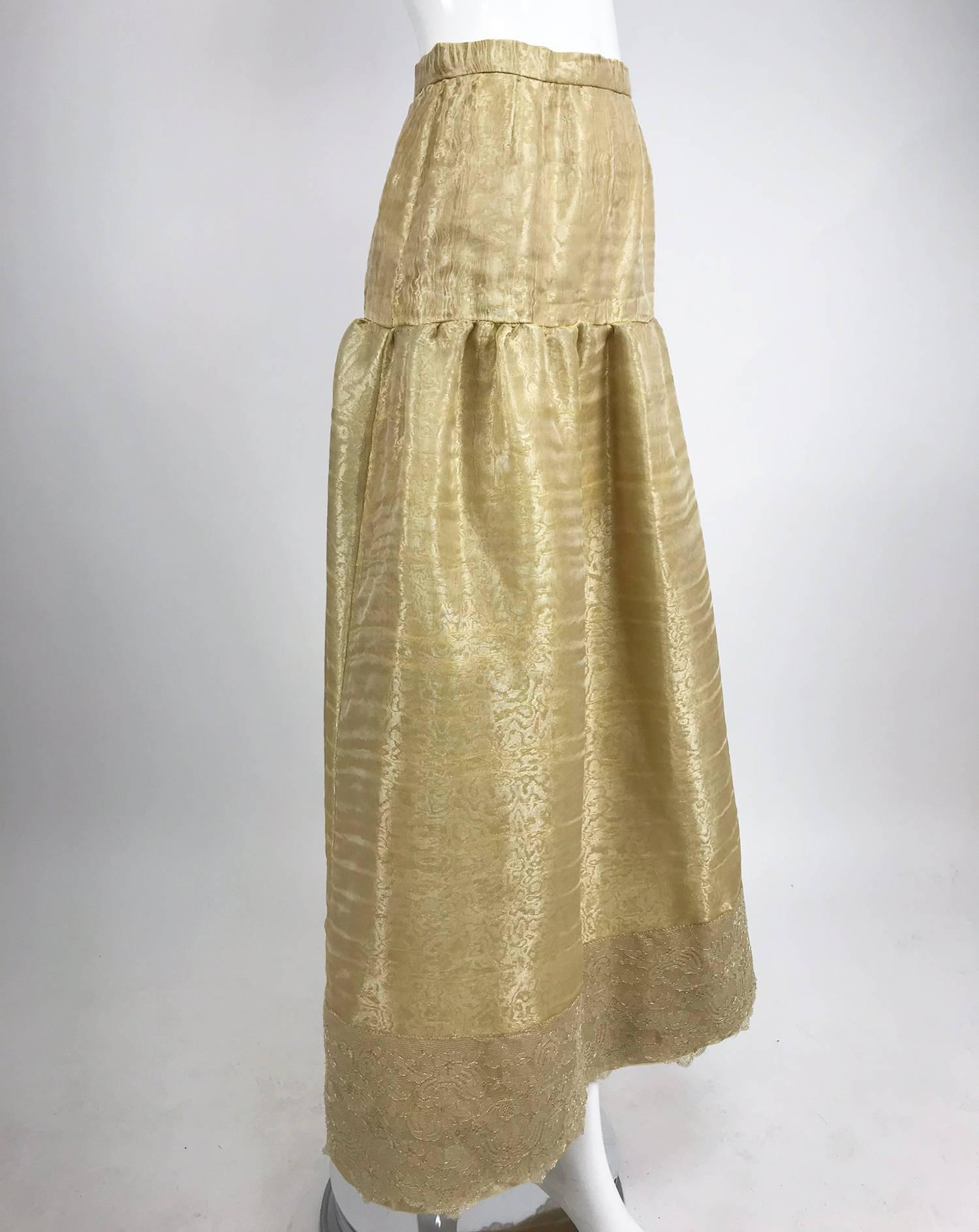 Emanuel Ungaro Studio Couture gold spun silk evening skirt...This beautiful skirt is made of the most amazing fabric, loosely woven silk organza which is interlined with silk organza, the skirt is lined in gold silk satin...Yoke top skirt is lightly