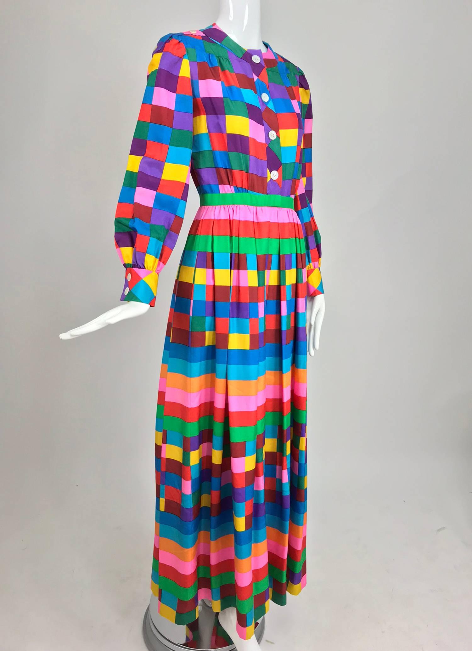 Valentino Boutique silk colour block maxi dress from the 1970s...Vivid colour blocks and and stripes are done on a mid weight silk fabric...The dress has a round band neckline and closes at the front with buttons and hand made bound button holes,