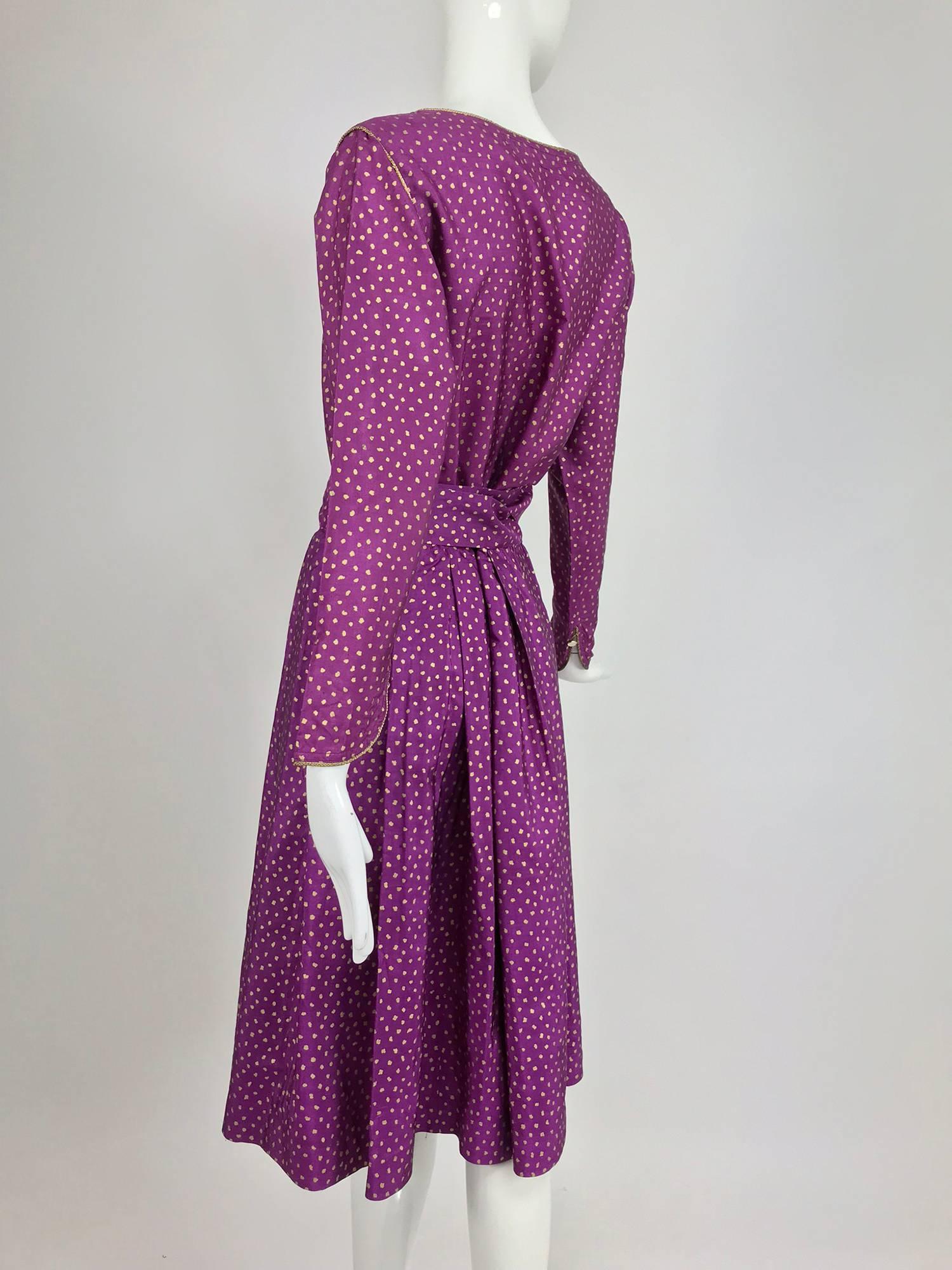 Yves Saint Laurent fuchsia silk with gold print top, skirt and belt from the 1970s...Amazing colour and the print really pops!  The button front long sleeve blouse has a scoop neckline with gold cord trim and gold buttons at the front, the shaped