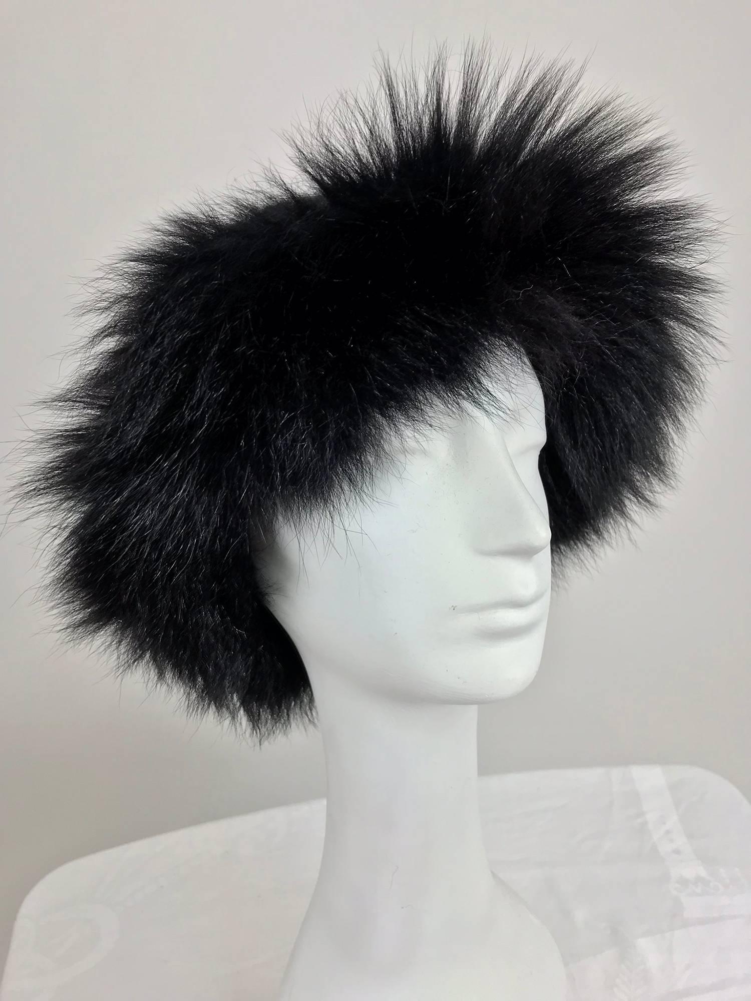 Lillie Rubin black fox fur and gold metallic knit hat from the 1970s...Knitted cap with a band of full fluffy fox fur around the edge...Unlined...Fits size Small-Medium.