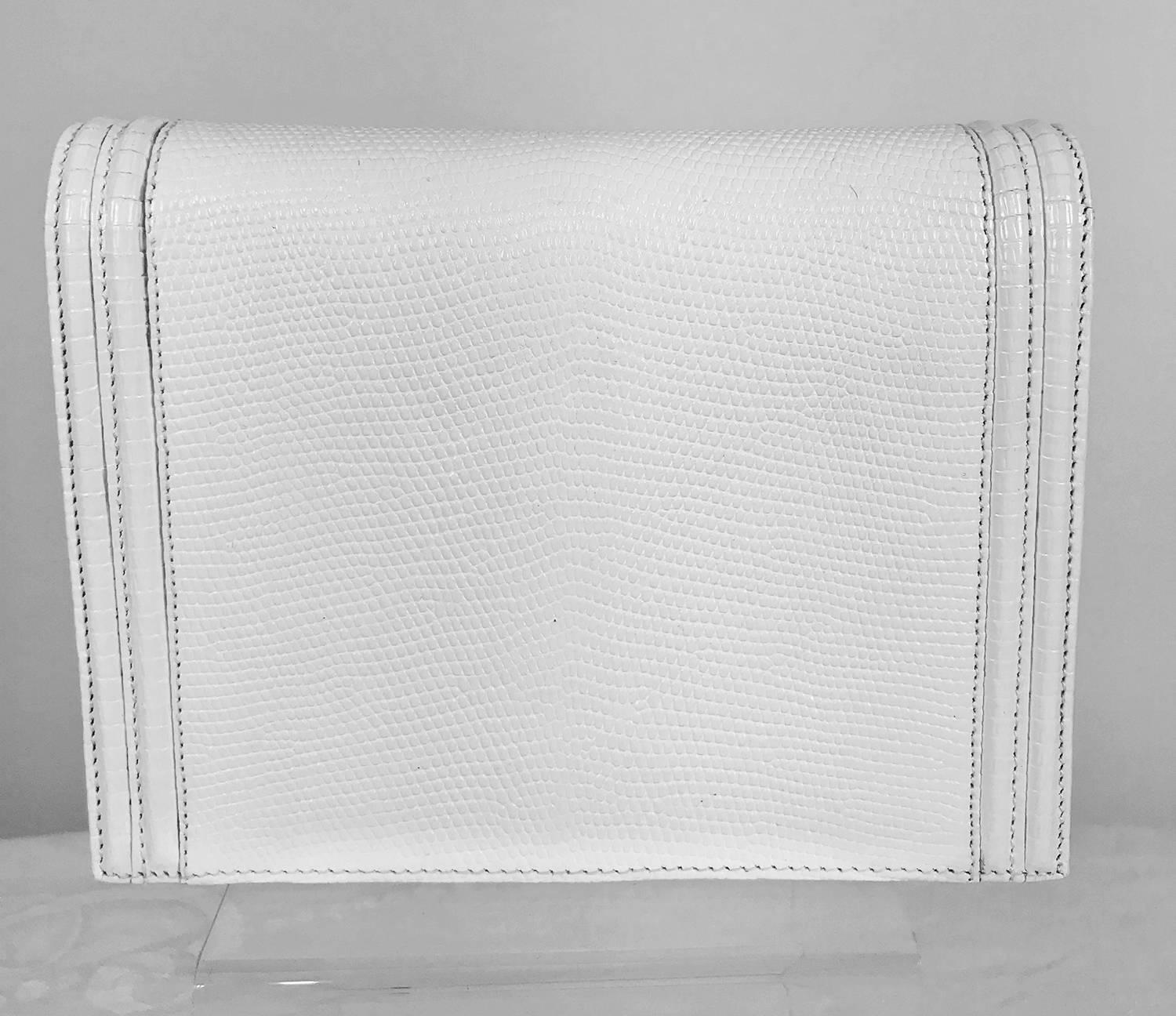 Lana of London white envelope style lizard clutch with gold hardware. Beautiful bag in textured lizard, matte gold hardware, lined in white leather with a single zipper compartment. In very good condition, missing the shoulder strap. There are some