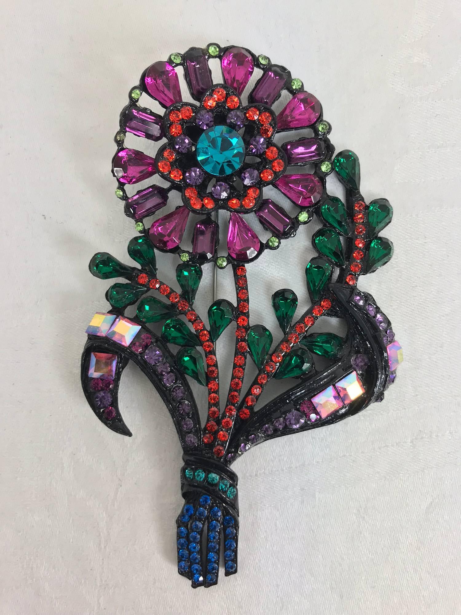 Thelma Deutsch large rhinestone flower brooch with multi-colour stones from the 1980s.
Approximate measurements:
5 1/4