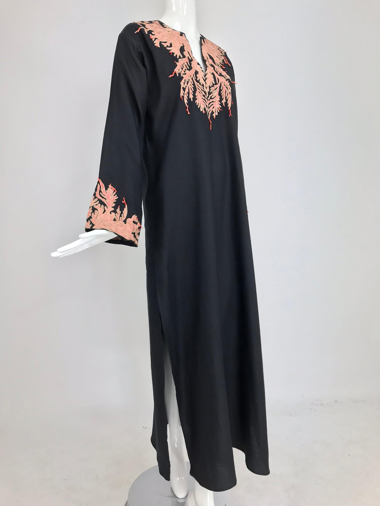 Jeannie McQueeny coral embroidered black linen caftan. Jeannie McQueeny caftans are a treasure to find, as no one lets them go and they are done in limited editions. This black linen caftan is particularly special as the bold colour combination is