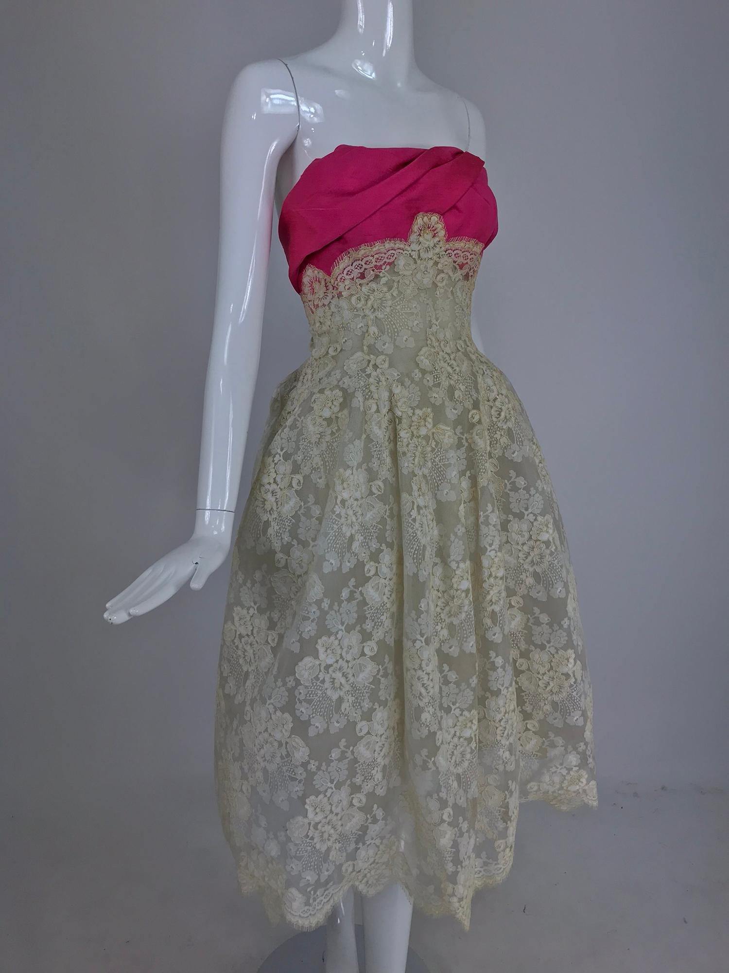Hattie Carneige Custom couture made strapless cream guipure lace and pink silk wedding or cocktail dress from the 1950s. This gorgeous dress is handmade and a beautiful example of Carnegie's custom work, possibly designed by Gustave Tassell in the