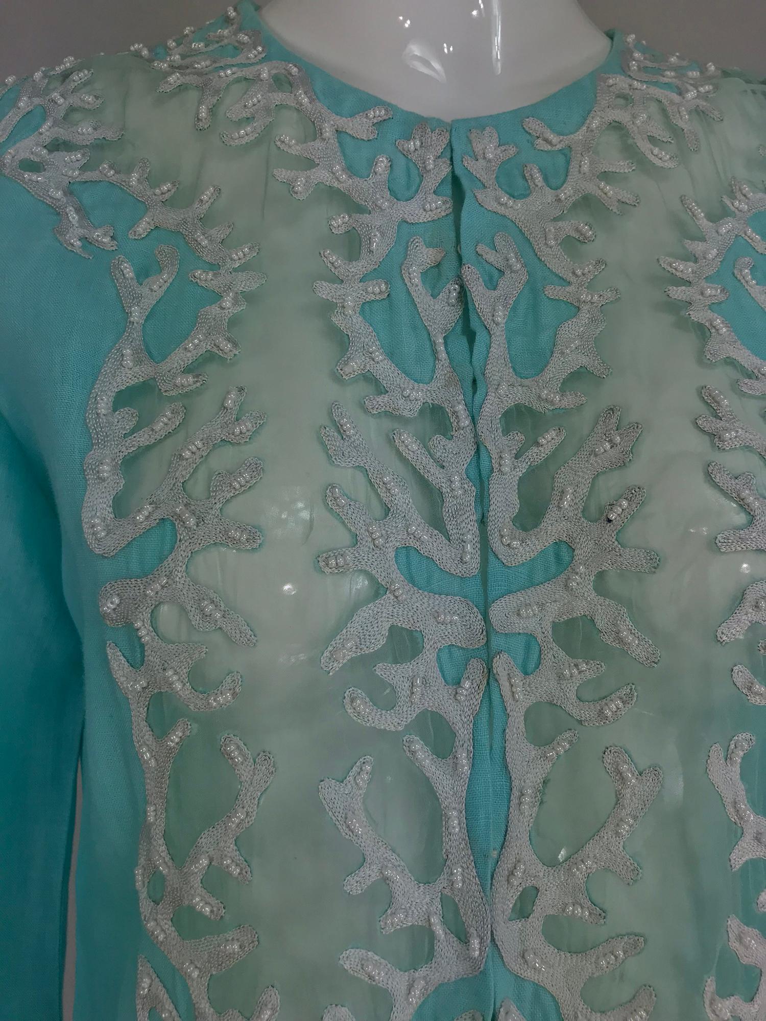 Jeannie McQueeny turquoise linen embroidered silk organza long jacket. This beautiful jacket is made from linen that is almost Tiffany blue, the front facings, neck and cuffs are of white beaded and embroidered silk organza. The jacket is semi