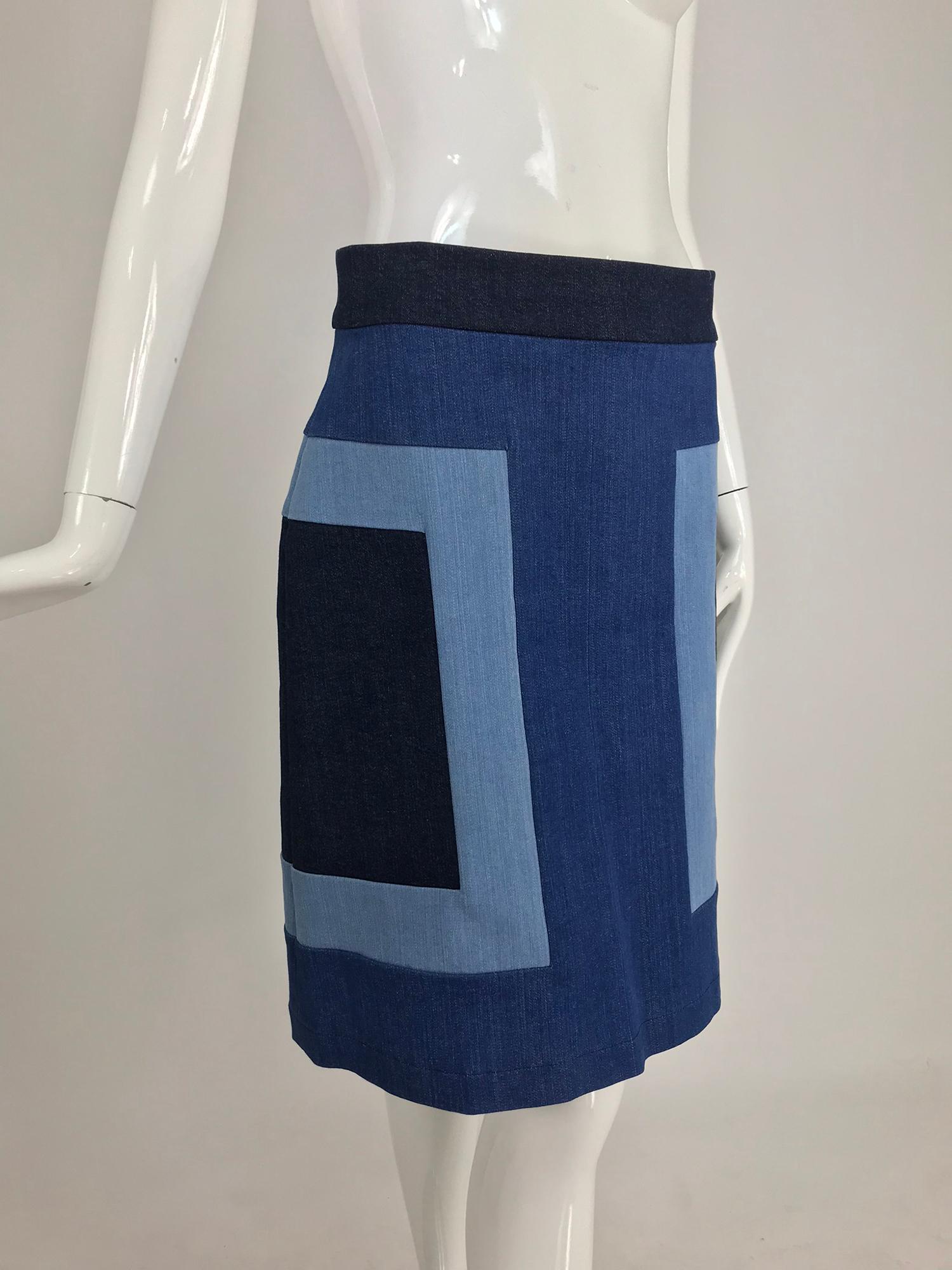 Escada Denim Colour Block Skirt. A line skirt with bold blocks of various washes of denim that are stitched together to form the design, the skirt closes at the back with a heavy silver zipper and logo pull tab. Unlined. Marked size 36.
In excellent