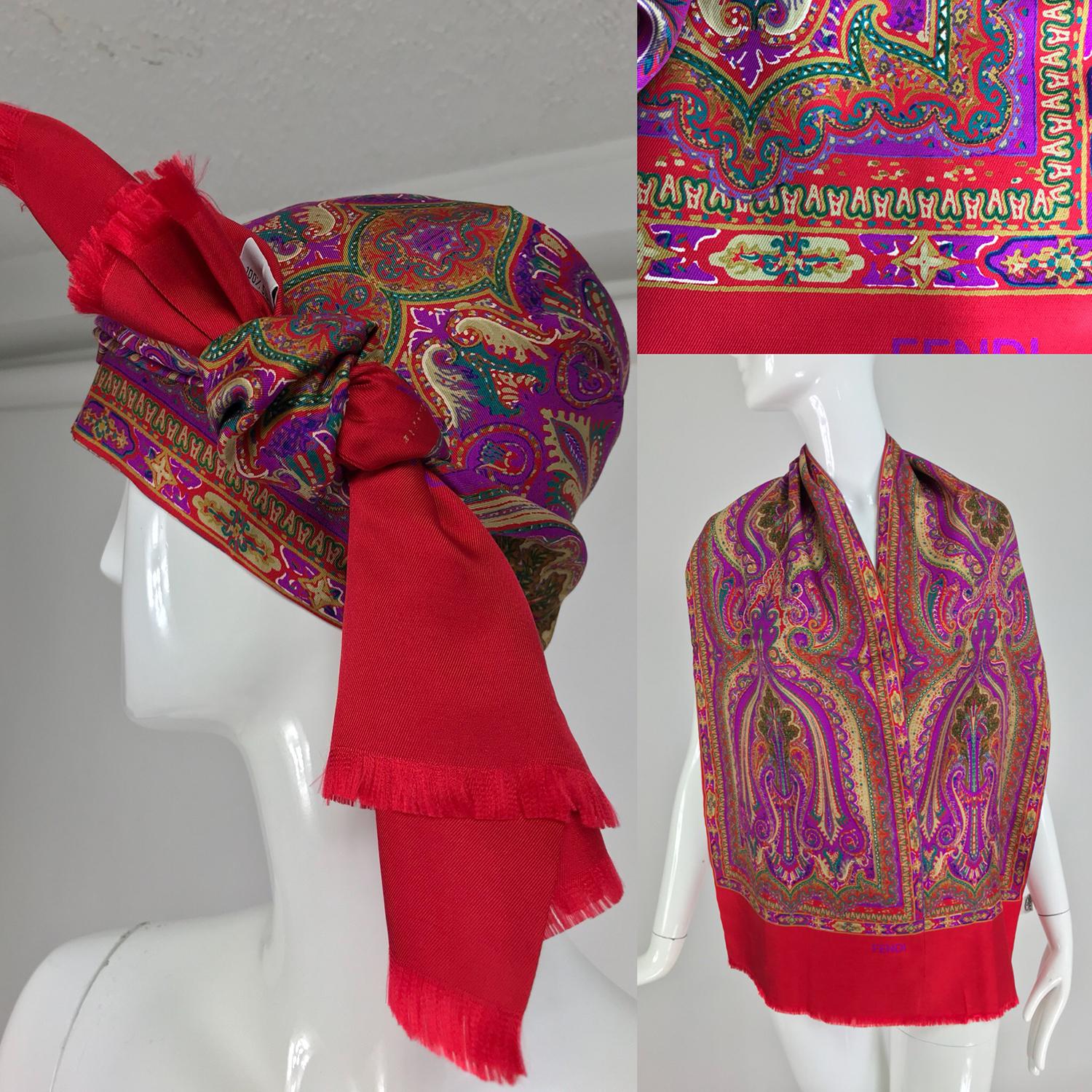 Fendi paisley silk oblong scarf in reds and fuchsia. This beautiful scarf is long and wide and is double with a side seam and self fringe at either end. Looks barely worn. There is a little bit of over printing, looks like a fine dash of gold, see