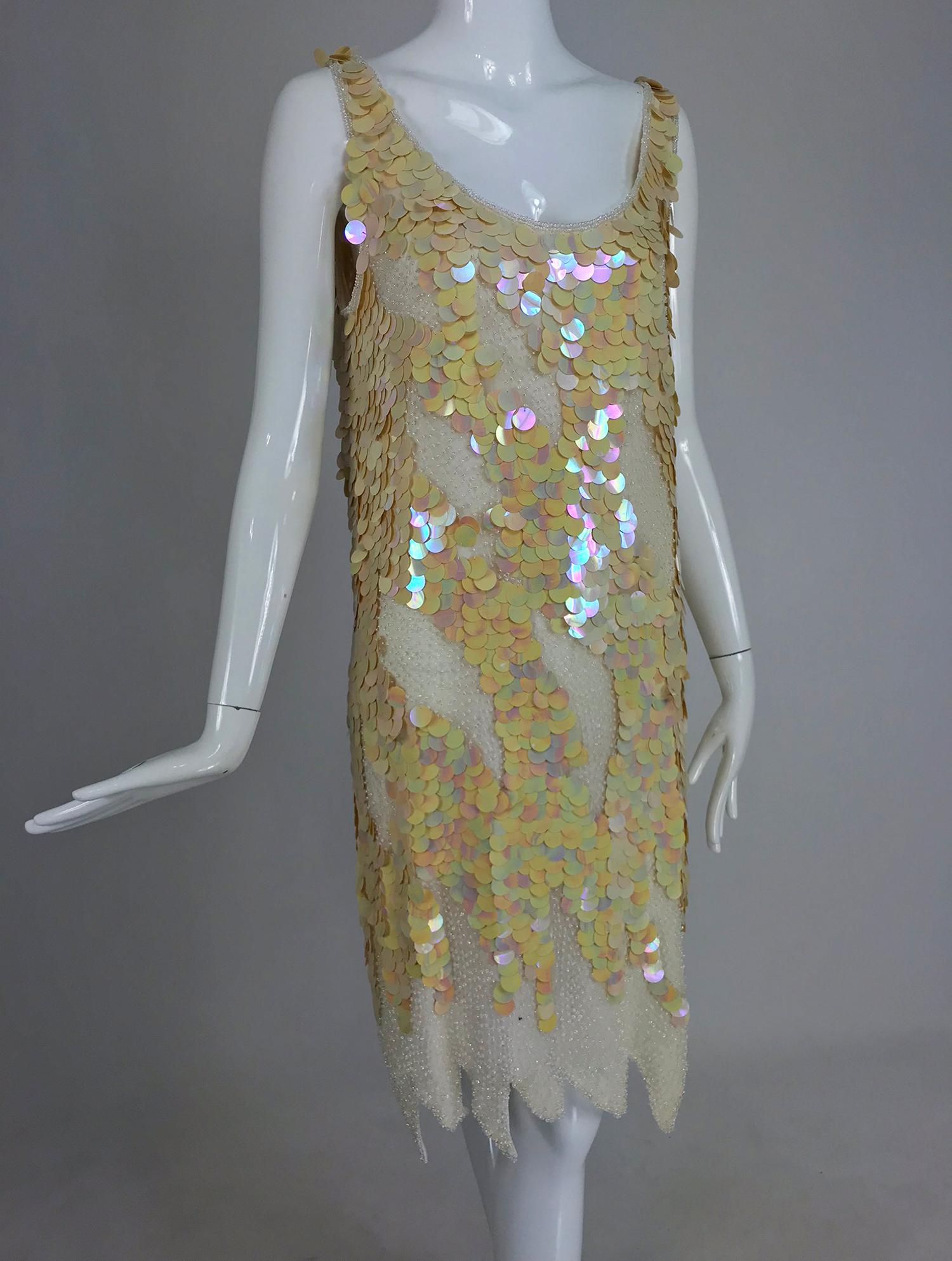 Swee Lo Beaded Iridescent Paillette 1920s inspired dress from the 1980s marked size Large, NWT.  Amazing flapper style dress from the 1980s, unworn with original tags. Pale peachy pink, iridescent medium size paillettes are set in a pattern, they