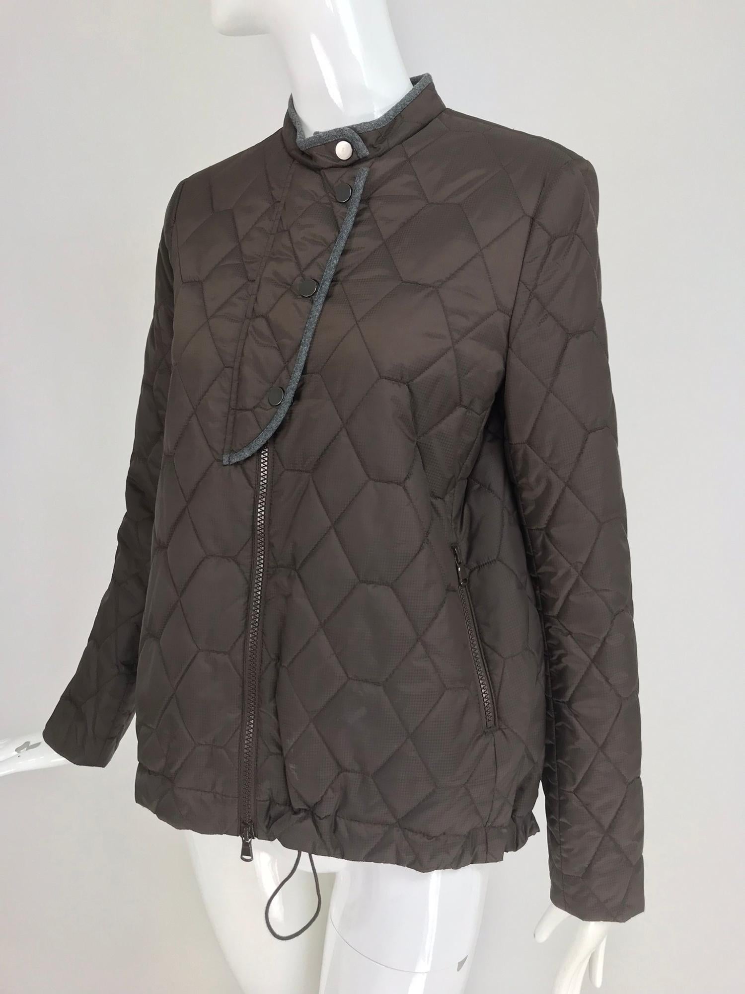 Brunello Cucinelli Chocolate Brown geometric pattern Quilted Sport Jacket. Zip front jacket, has a snap chest flap at the top. The jacket has a draw cord with toggle hem. Lower front zipper closure pockets. The zippers are brown and chunky.