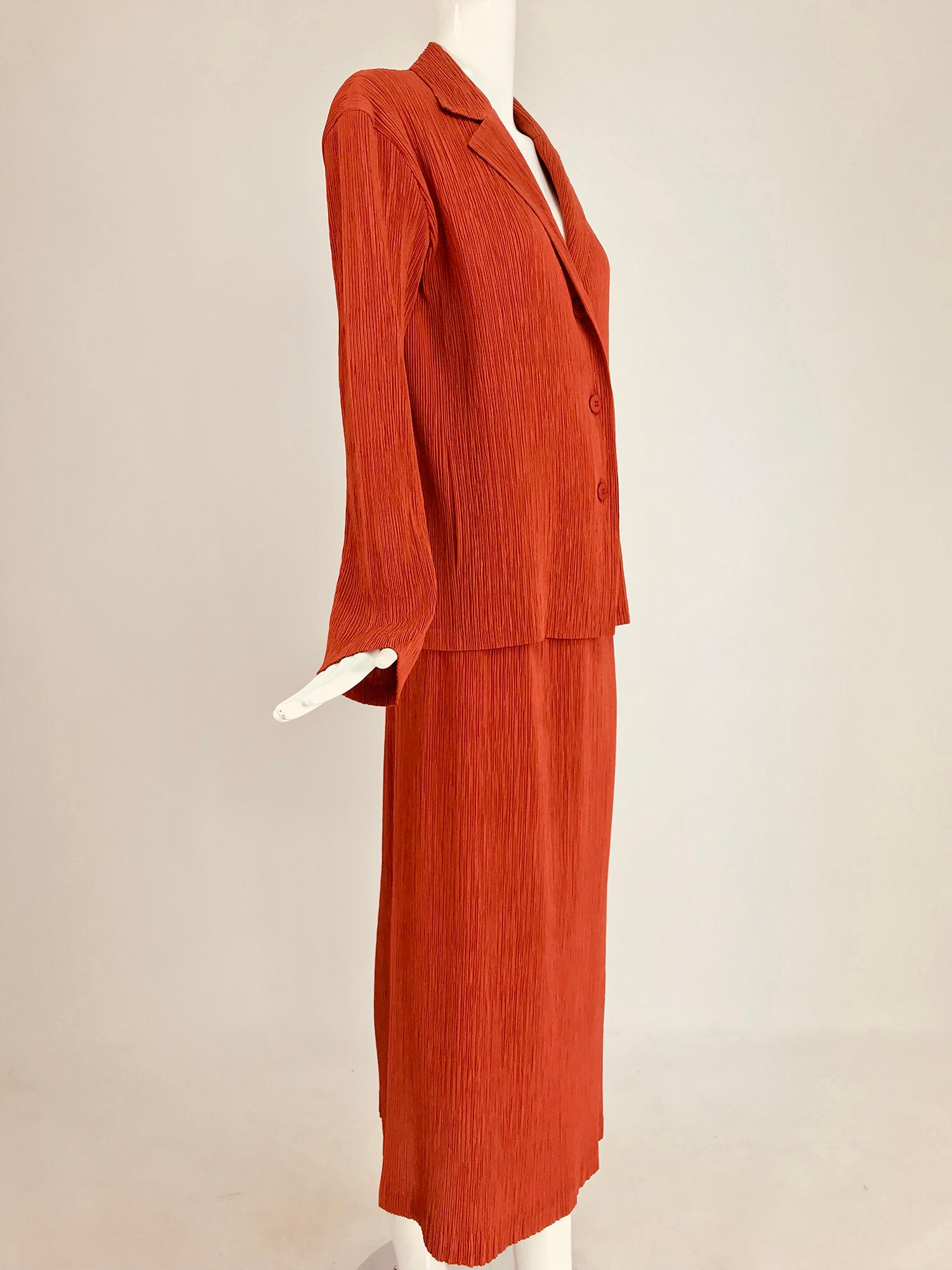 Issey Miyake Fete paprika pleated top and skirt set. Gorgeous paprika colour, long sleeve three button front blouse with notched lapels is unlined, the matching maxi skirt has a cased elastic waist and is also unlined. Marked size 4. Both pieces are