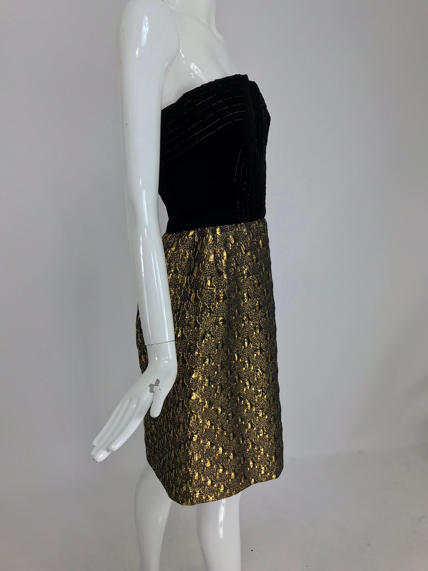 Jacqueline de Ribes gold metallic and black velvet strapless cocktail dress from the 1980s. Chic little cocktail dress with a black velvet bodice, the velvet is top stitched in gold, the center front vent accents the bust. Seamed waist with a