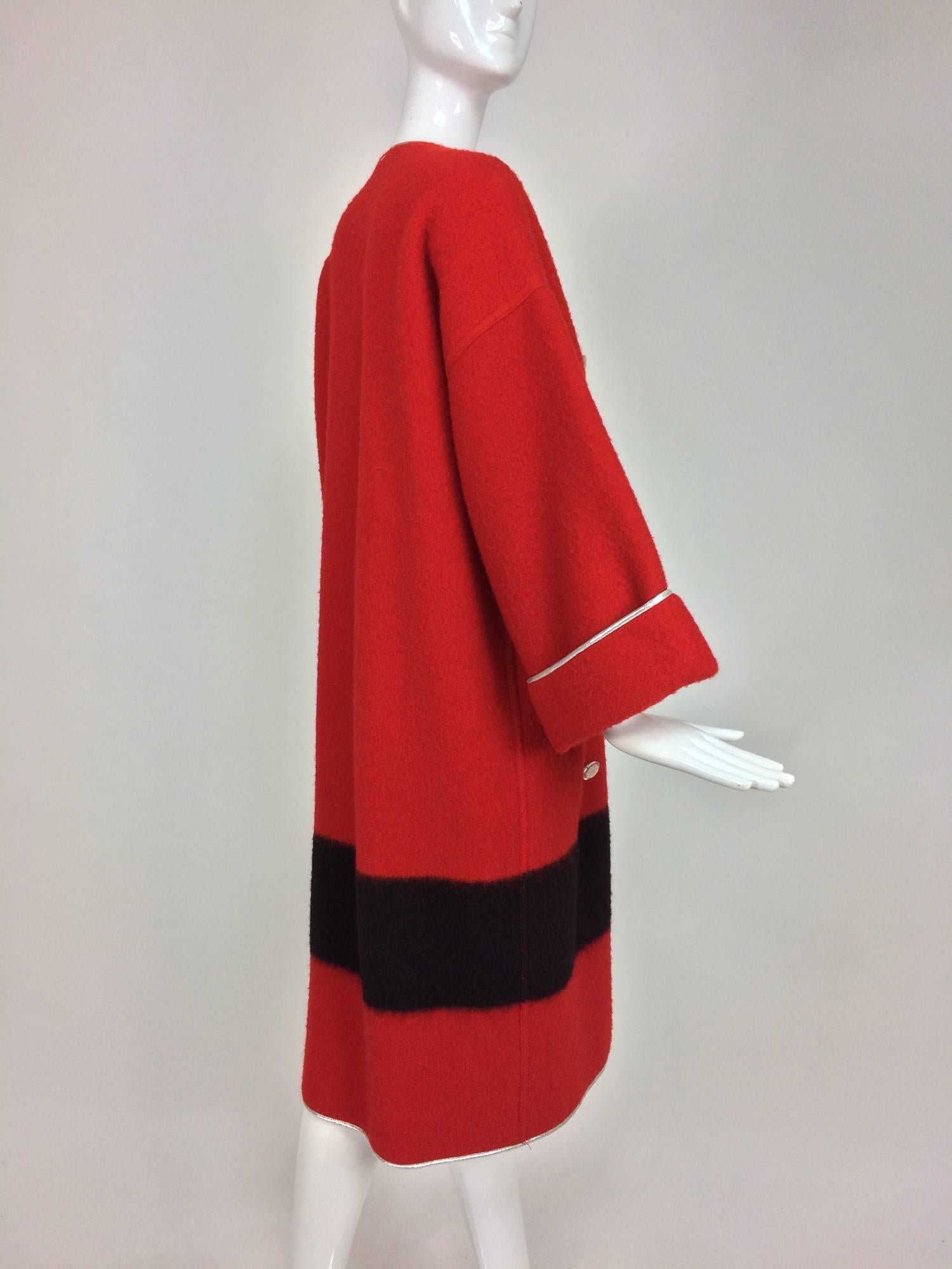 Geoffrey Beene red and black wool blanket coat with silver lame trim from the 1970s. Beene was famous for his fabric combinations and this double face wool, this Hudson's Bay style blanket coat, combines the country style wool with delicate silver