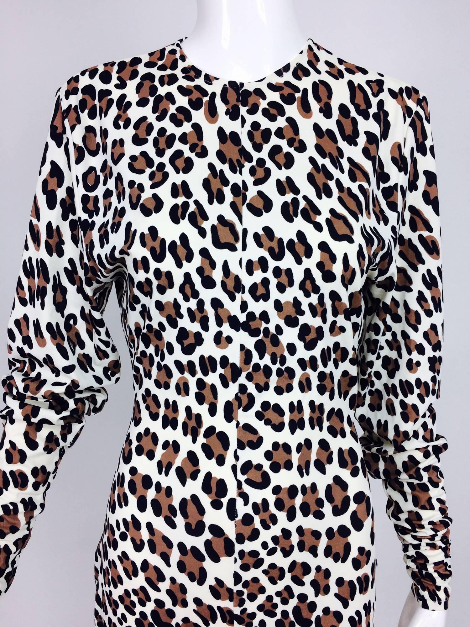 Vintage Norma Kamali leopard print cat suit 1980s. Silky nylon/Lycra has lots of stretch. Long sleeves with a jewel neckline, closes at the back with a hook and eye there is a deep vent below. Fitted below the bust through the hip and legs. The