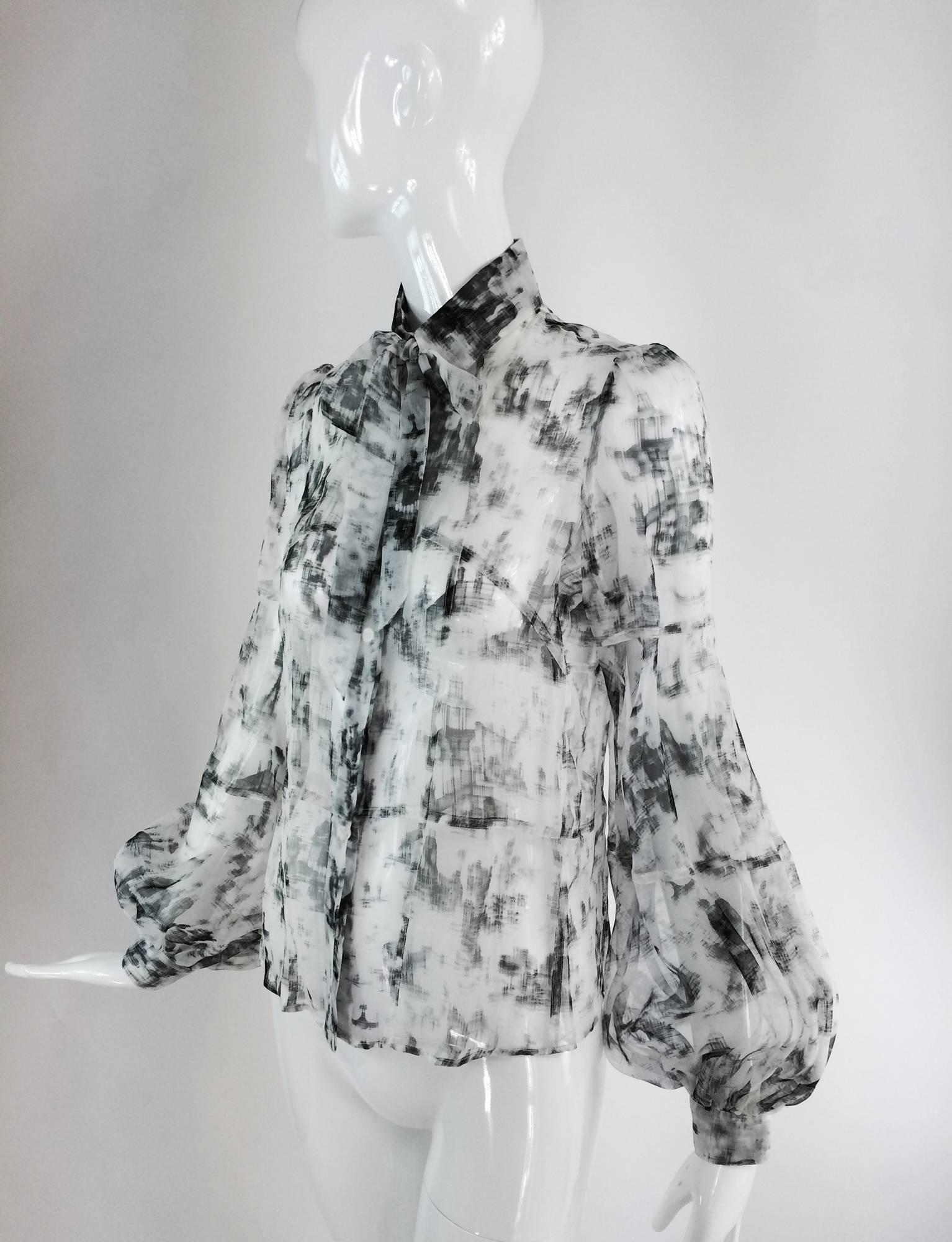 Valentino Hiver 2008 black & white organza blouse...Modern print in shades of gray to black...Fitted blouse with self bow at the collar, placket front with logo buttons, horizontal seaming in the torso...Long sleeves with fullness at the wrist,