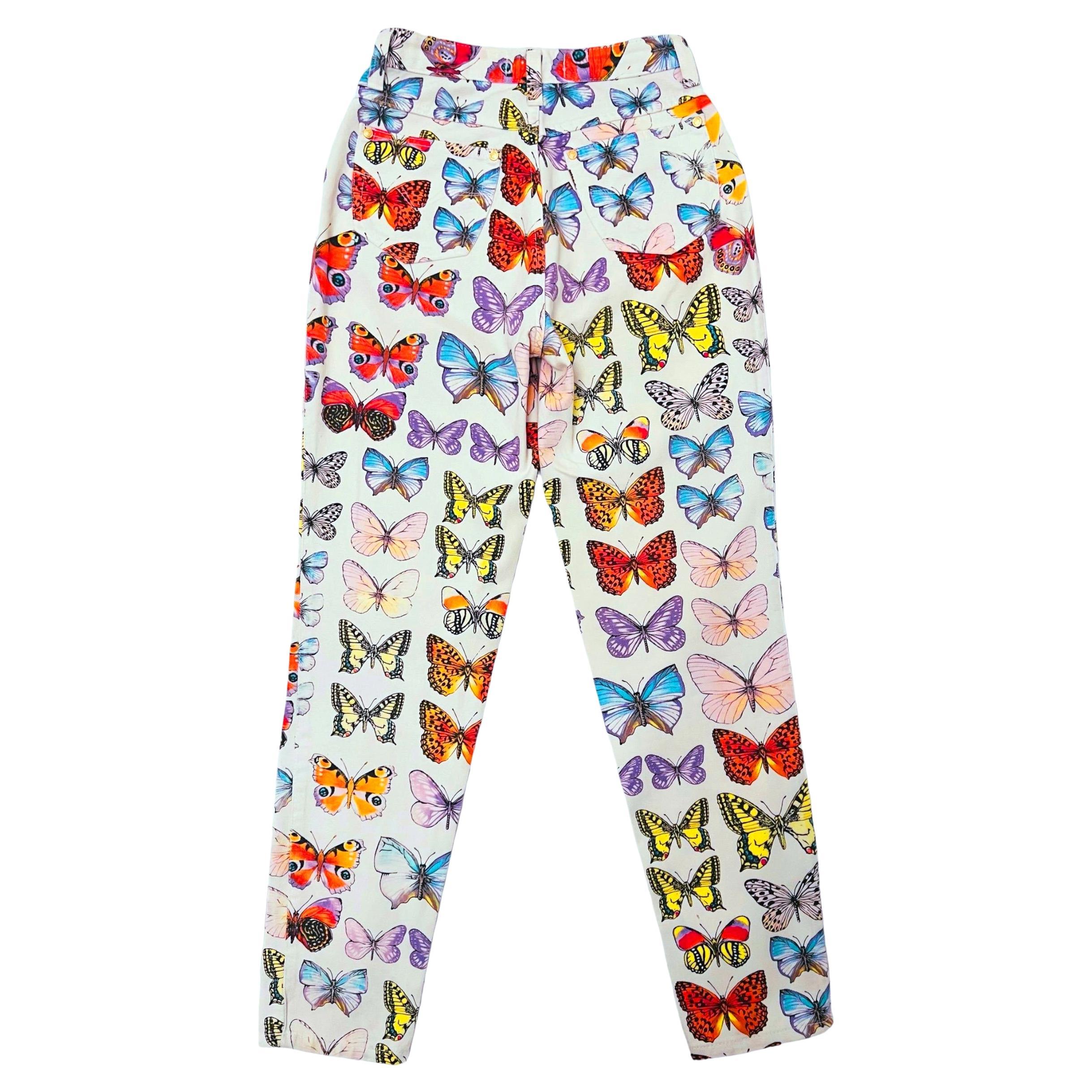 Versace butterfly print jeans from Spring Summer 1995.

White denim jeans printed with an energetic butterfly motif throughout.

Condition: Good condition. There are a few miniscule spots around the ankle. (Not noticeable because of the busy print)