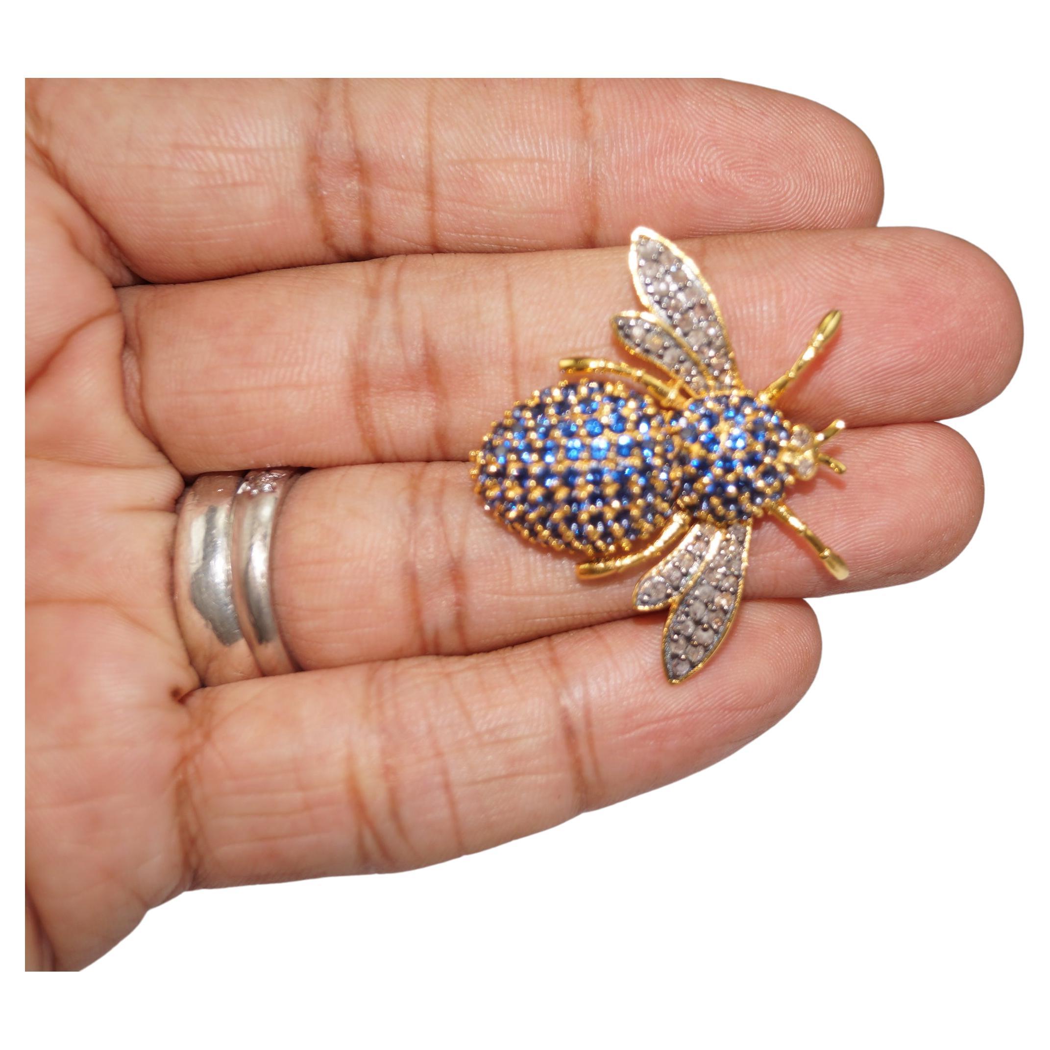 This Gorgeous Queen Bee Diamond Sapphire brooch is a unique handcrafted art. It brings back the memory of the Victorian era. It has been crafted in 925 sterling silver with 18K Gold Plating over silver. Real Natural diamonds are studded in prong
