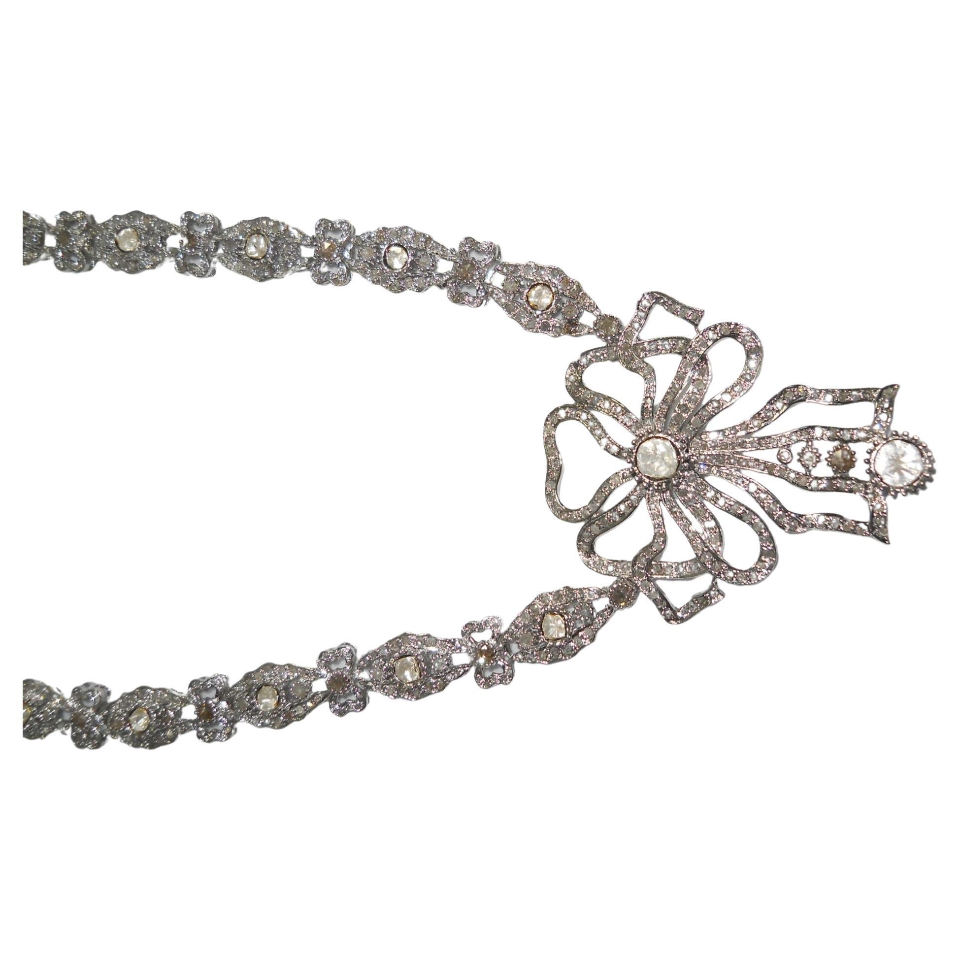 This gorgeous ribbon bow uncut rose cut diamond Gold necklace is unique in itself. It has been created by the fine artisans using Natural real Uncut Diamond and real rose cut diamonds. The diamonds have been set in such a way that their luster