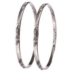 Paire de bracelets vintage emboîtables en argent oxydé, sertis de diamants en pavé