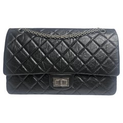 Chanel - Sac à rabat Reissue 227 en cuir de veau froissé noir