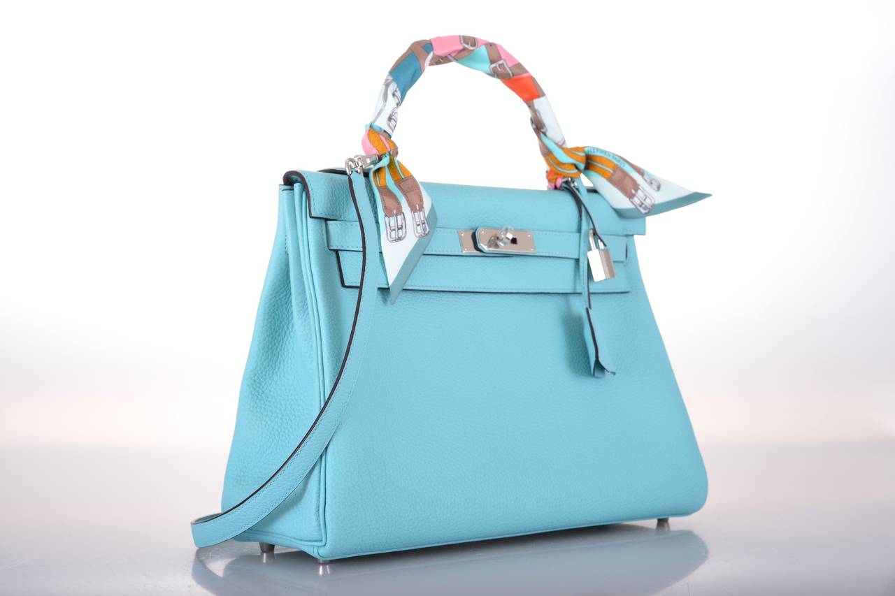 As always, another one of my fab finds! Hermes KELLY 32cm. NEW INCREDIBLE NEW TIFFANY COLOR BLEU ATOLL WITH PALLADIUM HARDWARE!

This bag is brand new with original box and accessories.

**Note: Accessories used for JaneFinds photo shoots are
