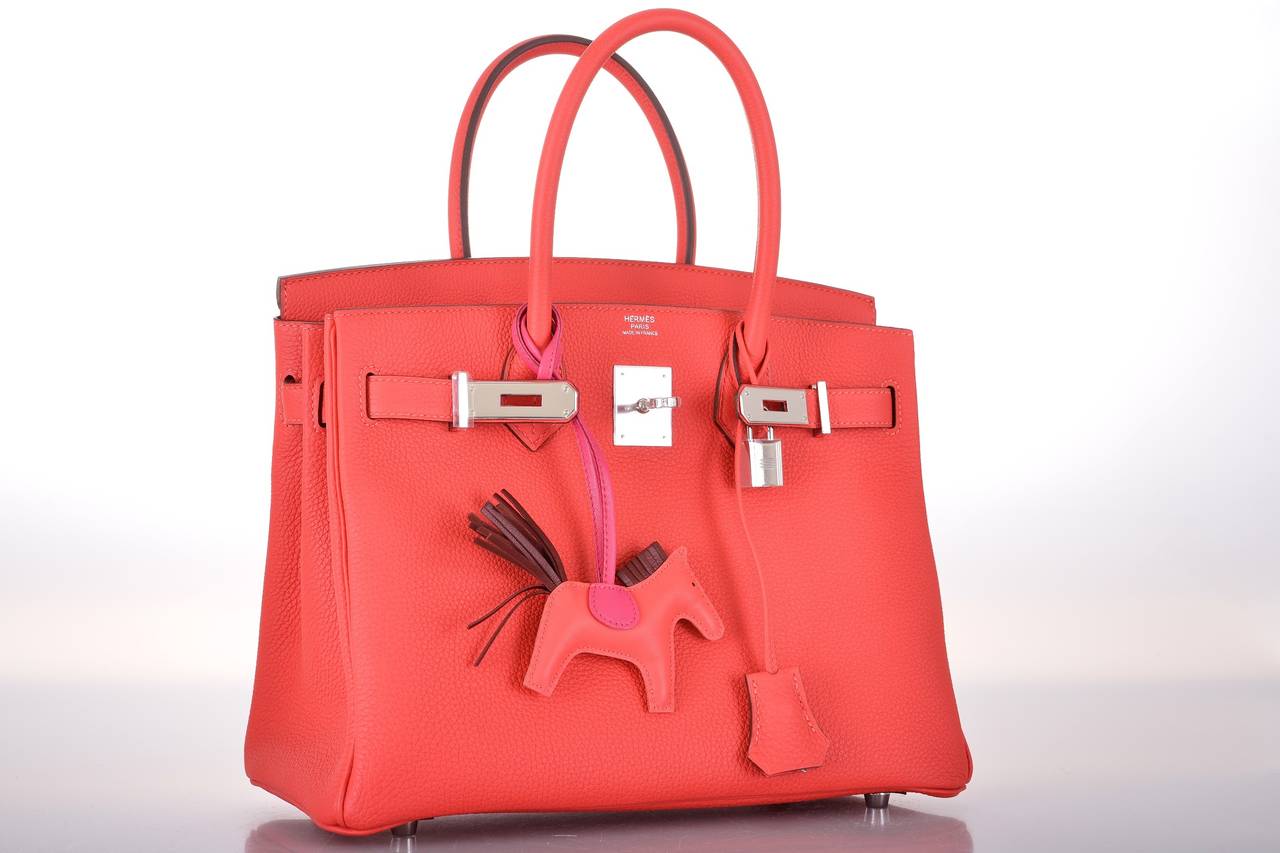 As always, another one of my fab finds! Hermes 30cm Birkin in beautiful BRIGHT ROUGE PIVOINE with palladium hardware.

This bag comes with lock, keys, clochette, a sleeper for the bag, rain protector, box, and ribbon.
The bag is Brand NEW WITH