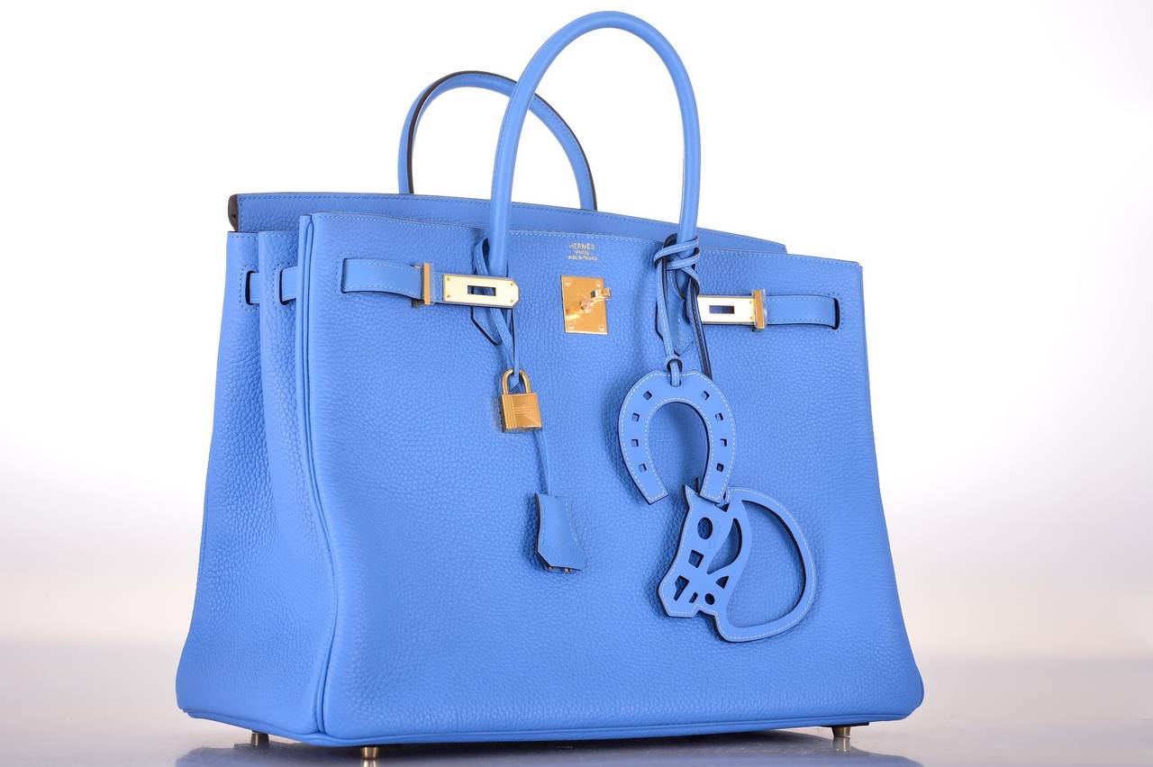 As always, another one of my fab finds! NEW INCREDIBLE COLOR Hermes BIRKIN BAG 40cm BLUE PARADISE!
This blue is really stunning like no other blue before! It will take your breath away!
In beautiful TOGO leather with GOLD hardware.

This bag is