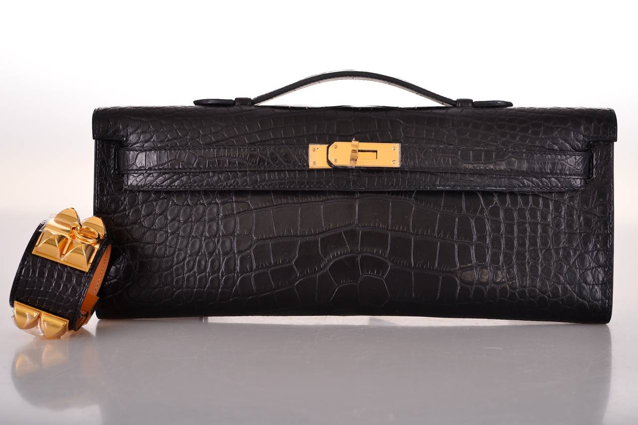 As always, another one of my fab finds! CAN'T GET THIS! Hermes KELLY CUT IN THE MOST AMAZING MATTE CROC!
CLASSIC GORGEOUS BLACK  ALLIGATOR with GOLD hardware,
MEASURES:
12 1/4 x 5