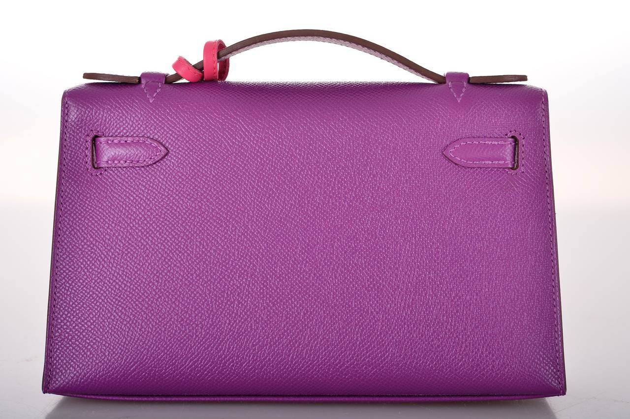 As always, another one of my fab finds! Hermes NEW COLOR ANEMONE POCHETTE IN THE MOST AMAZING BRIGHT PURPLE EPSOM with PALLADIUM  hardware.

                           MEASUREMENTS:
LENGTH: 8.5