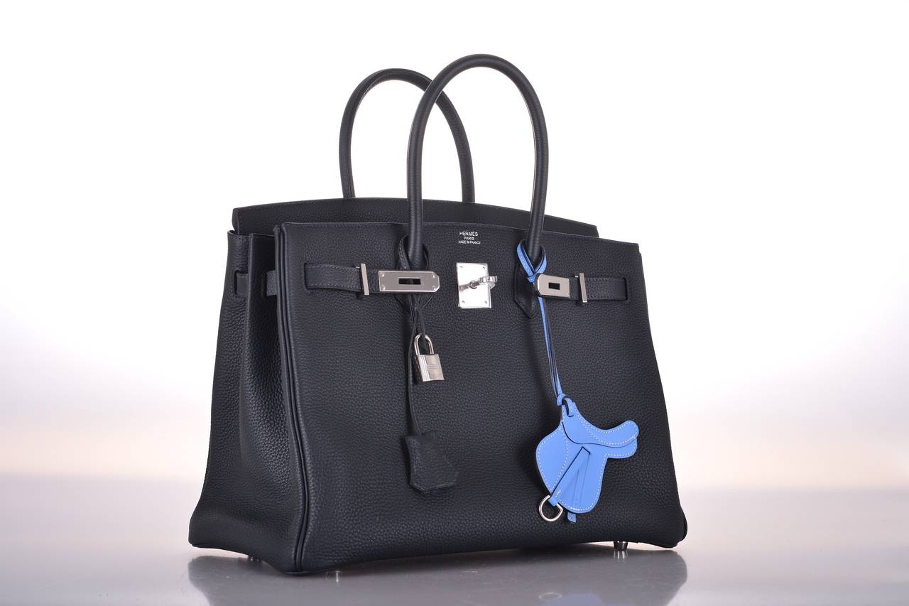 As always, another one of my fab finds! The Hermes 35cm Birkin Bag in beautiful BLUE OCEAN with palladium hardware. This bag is Togo leather. Very special and super rare color. This is a true Janefinds! 

This bag is brand new  comes with lock,