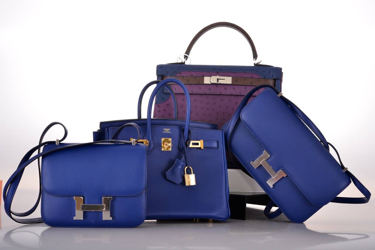 Hermes 25cm Blue Sapphire Swift Leather Constance Elan Bag with Palladium Hardware
Pristine Condition

10" Width x 6" Height x 2" Depth

The Constance bag is the perfect Hermes shoulder bag. The shoulder strap can be worn long