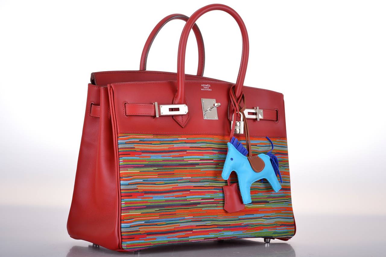 Hermes 35cm BIRKIN BAG VIBRATO (VERTICAL PATTERN OF DYED MOUNTAIN GOAT SKIN FOLDED IN MULTIPLE LAYERS AND CUT).

THE LEATHER COMBINATION IS CHAMONIX AND VIBRATO. THE COLOR OF CHAMONIX IS ROUGE H. THE COLORS OF VIBRATO ARE BLUES, REDS, BROWNS,