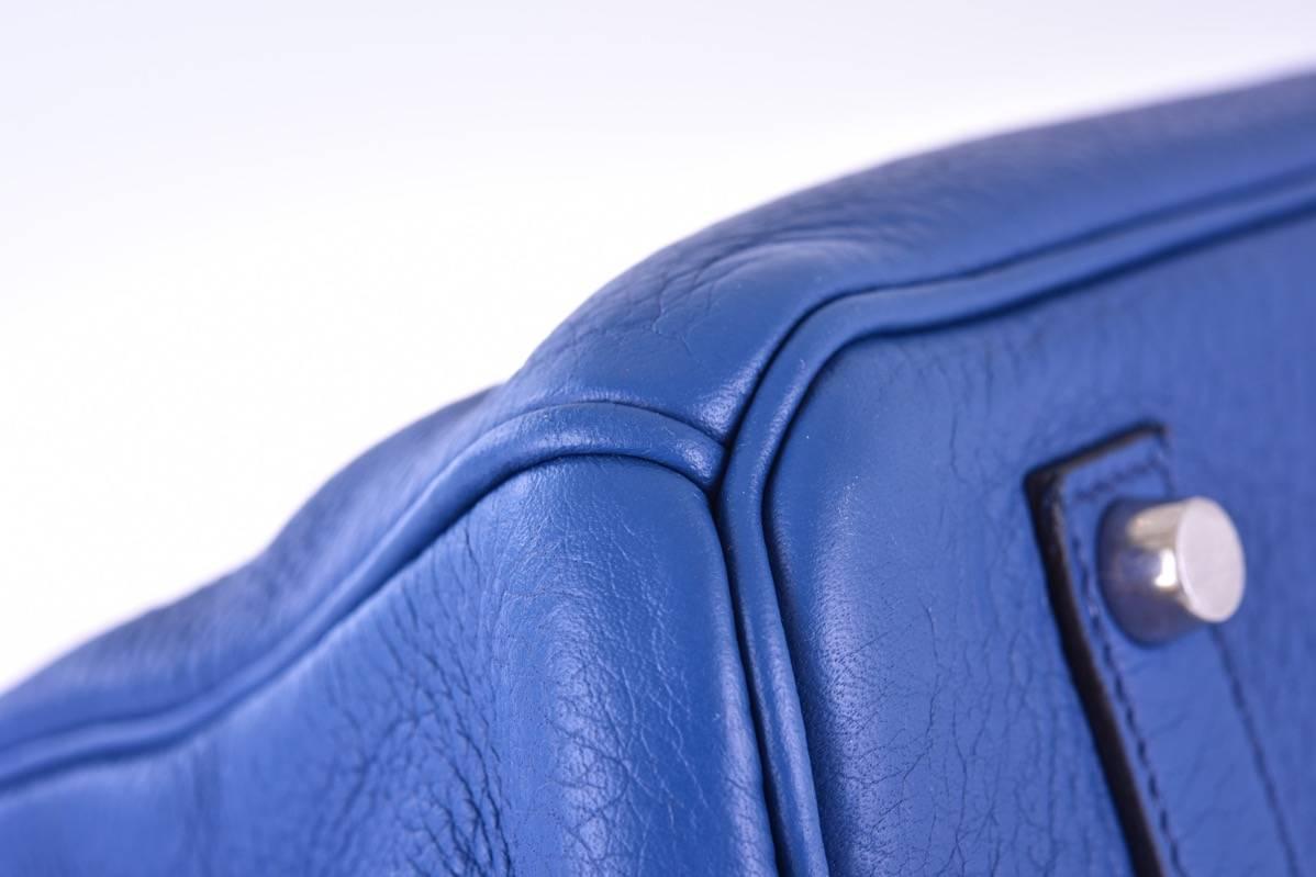 Hermes 35cm Birkin Bag Bleu Orage Palladium hardware

Excellent  Condition
Hardware: palladium 
Country of Origin: France
Color: Black; Bleu Brighton 
Accompanied by: Care Booklet, Dust Bag, Plastic Raincoat,
Closure: Clasp
Height (in