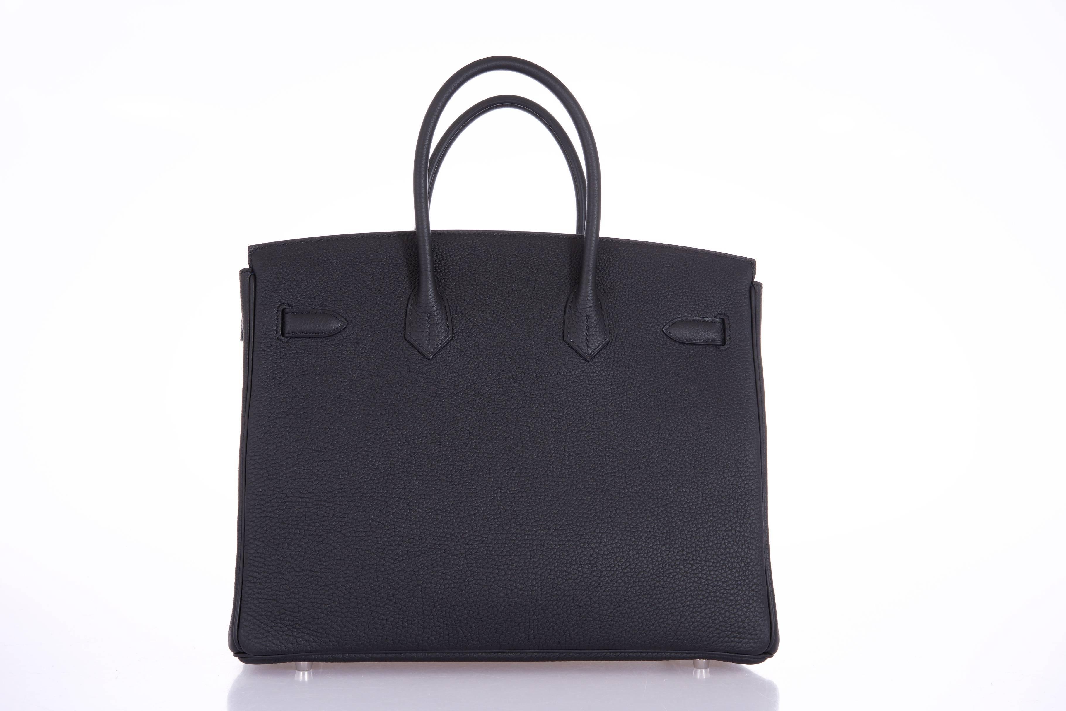 Hermes 35cm Birkin Bag Black & Blue Agate interior togo leather PHW

new Condition

Hardware: Palladium 
Country Of Origin: France
Color: Black/blue
Accompanied By: Care Booklet; Dust Bag Plastic Raincoat Box
Closure: Clasp
Height (In Inches):