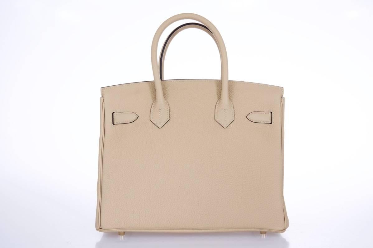 Hermes  New Color 30cm trench birkin with gold hardware 
New 
12" Width x 8" Height x 6” Depth
Hermes Birkin 30cm.

Stunning Classic new neutral birkin 30cm with gold  hardware in the most wanted togo.


The beauty of the Togo leather is