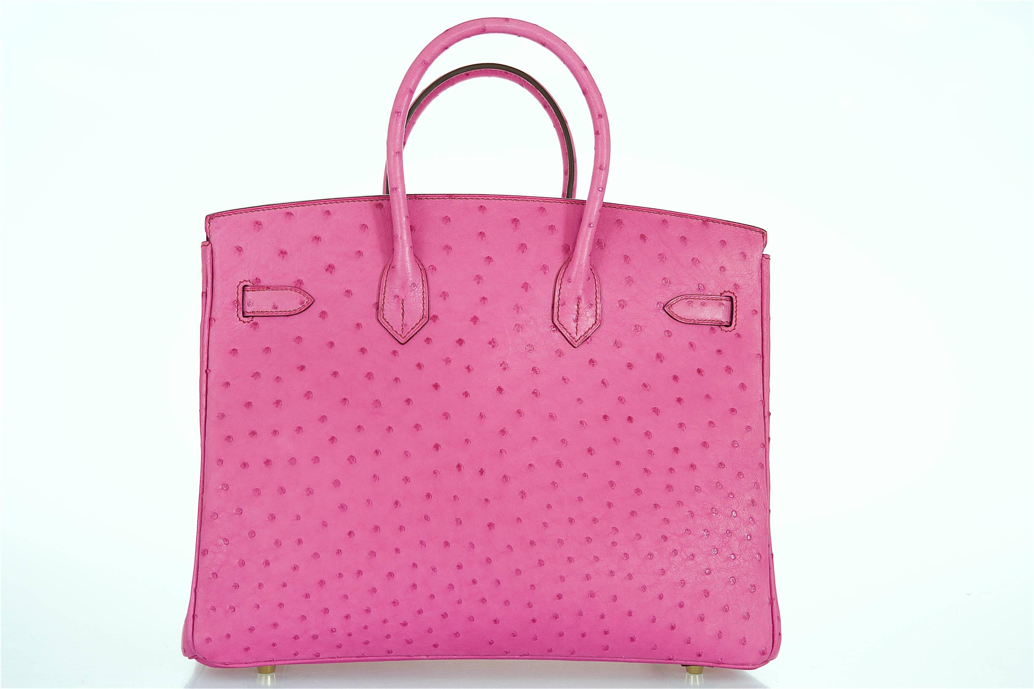 Hermes 35cm Birkin Bag very rare find  HOT PINK FUSCHIA Ostrich with chevre leather interior.

new Condition

Hardware: Gold 
Country Of Origin: France
Color: fuschia 
Accompanied By: Care Booklet; Dust Bag Plastic Raincoat 

Height (In Inches):