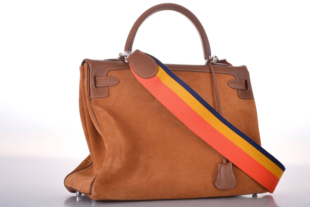 As always, another one of my fab finds! Hermes 35cm Kelly in beautiful rare LIMITED EDITION GRIZZLY SUEDE BIRKIN with Palladium hardware and the coolest 70’s rainbow strap. JF is right on trend.
THIS BAG IS LIGHTER THAN ANY LEATHERS FROM HERMES!
