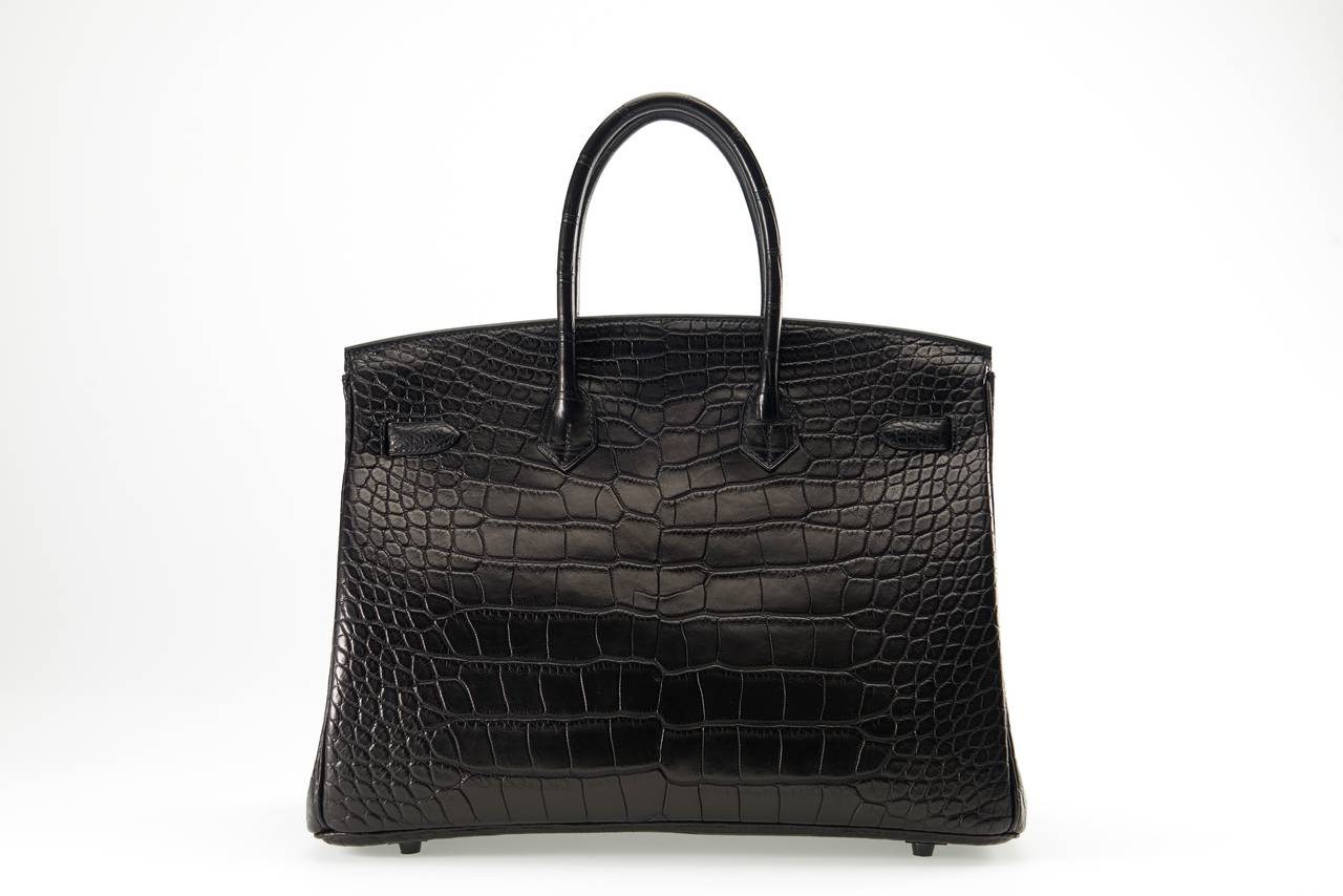 As always, another one of my fab finds! LIMITED Hermes 35cm SO BLACK ALLIGATOR BIRKIN BAG!
THIS BAG WILL TAKE YOUR BREATH AWAY! TRULY A MASTER PIECE!

This bag comes with lock, keys, clochette, a sleeper for the bag, rain protector, and box.
The