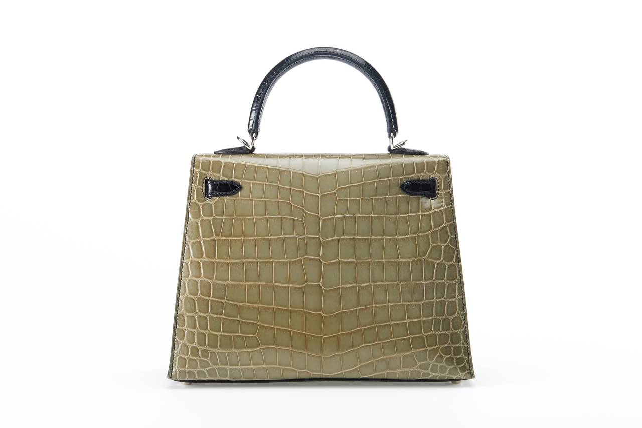 As always, another one of my fab finds! The Hermes 25Cm Kelly In Beautiful Impossible To Get Tri- Color Niloticus Crocodile In 3 Colors: Vert Jasmine, Canopee  And Black With Palladium Hardware!

From the JaneFinds personal collection.

This bag