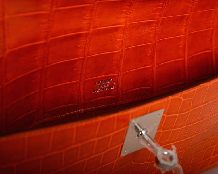 orange hermes kelly clutch  