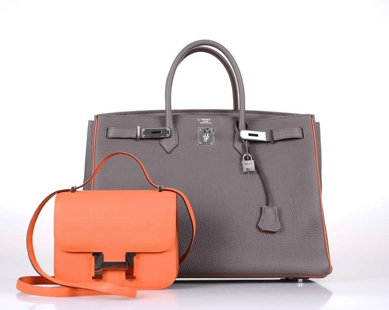 As always, another one of my fab finds! Hermes 40cm BIRKIN gorgeous ETAIN with orange piping & interior. Palladium hardware! Togo leather!
MY CAMERA TAKES ACCURATE PICTURES BUT THE COLOR IS REALLY GORGEOUS! VERY SPECIAL!

This bag comes with