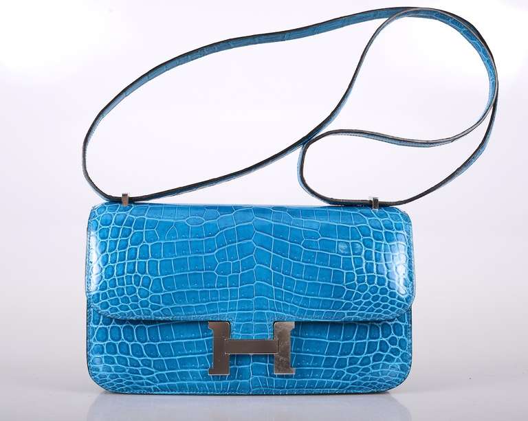 As always, another one of my fab finds! Hermes new constance elan 25cm. BLUE IZMIR COLOR! Comfy longer strap that is perfect on the shoulder and cross body wear!

Beautiful NILO CROCODILE. Palladium hardware.

This bag is brand new with original